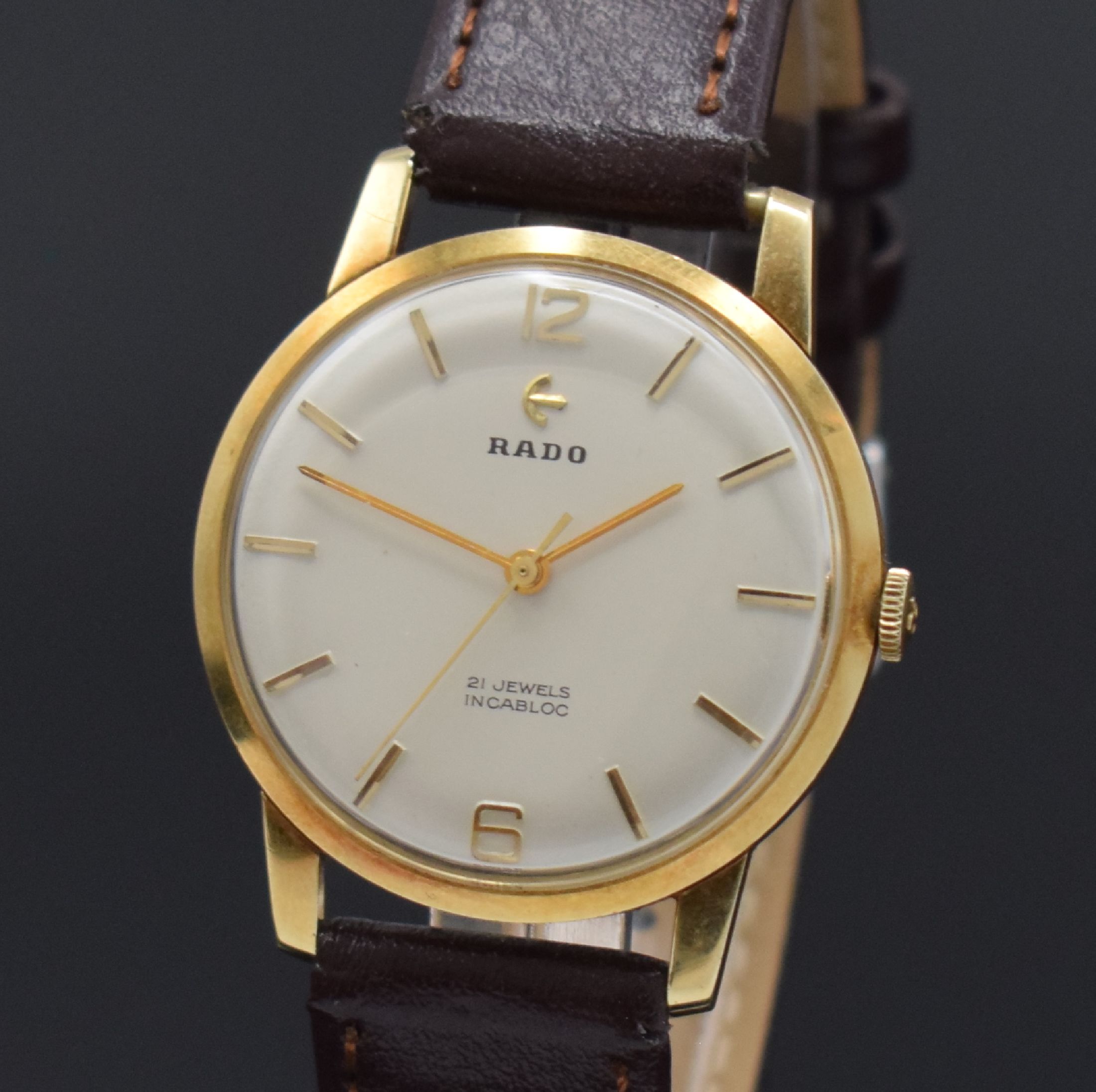 Detail a: RADO Herrenarmbanduhr in GG 585/000 Referenz 10584B, Schweiz um 1960, Handaufzug, Glasrand aufgedr., silb. Zifferbl. m. gold. Std.-Ind., gold. ...