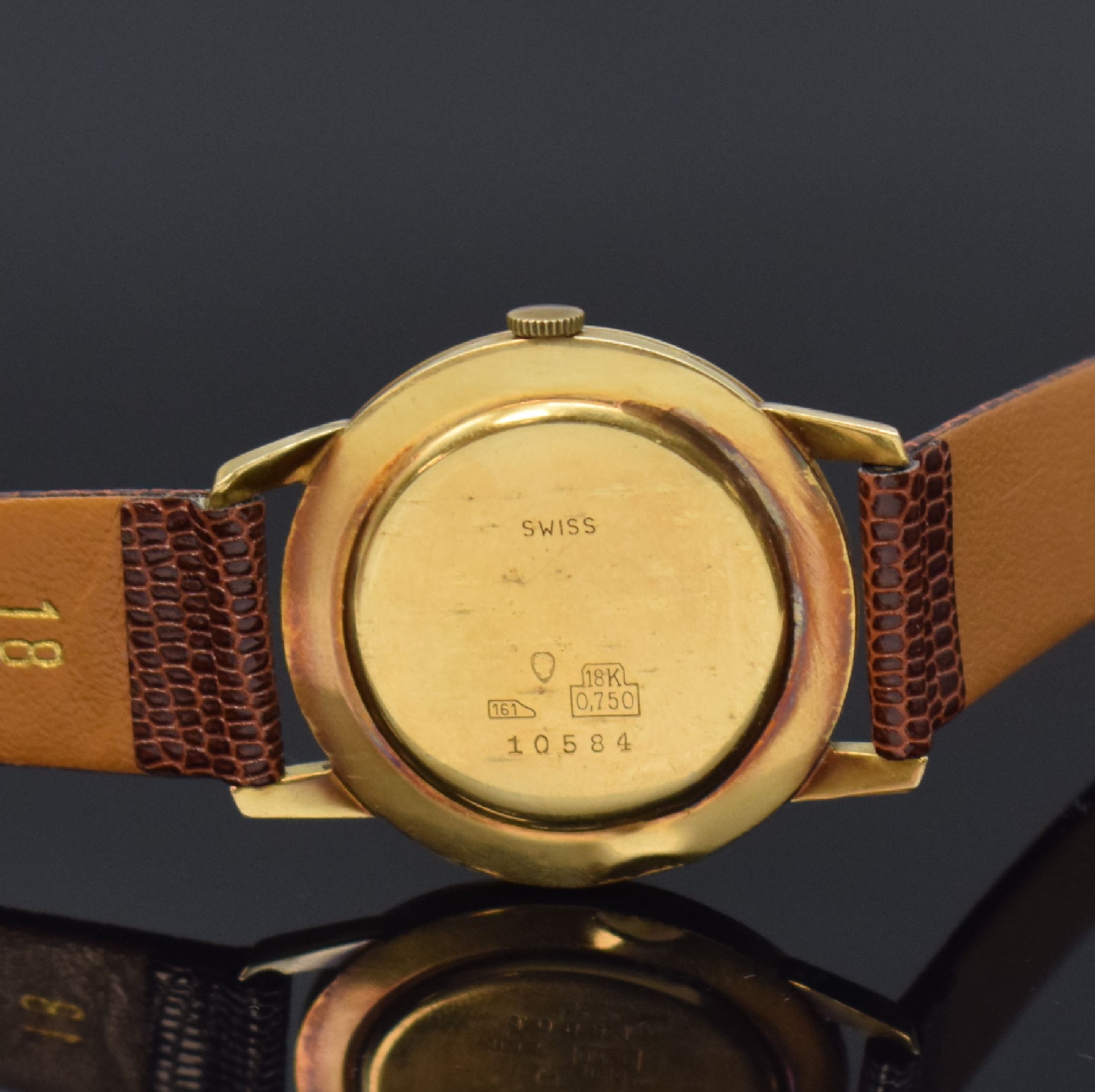 Detail c: RADO Herrenarmbanduhr in GG 750/000, Schweiz um 1960, Handaufzug, Glasrand aufgedr., Boden/Geh. dell., silb. Zifferbl. m. gold. Std.-Ind. l. fl., ...