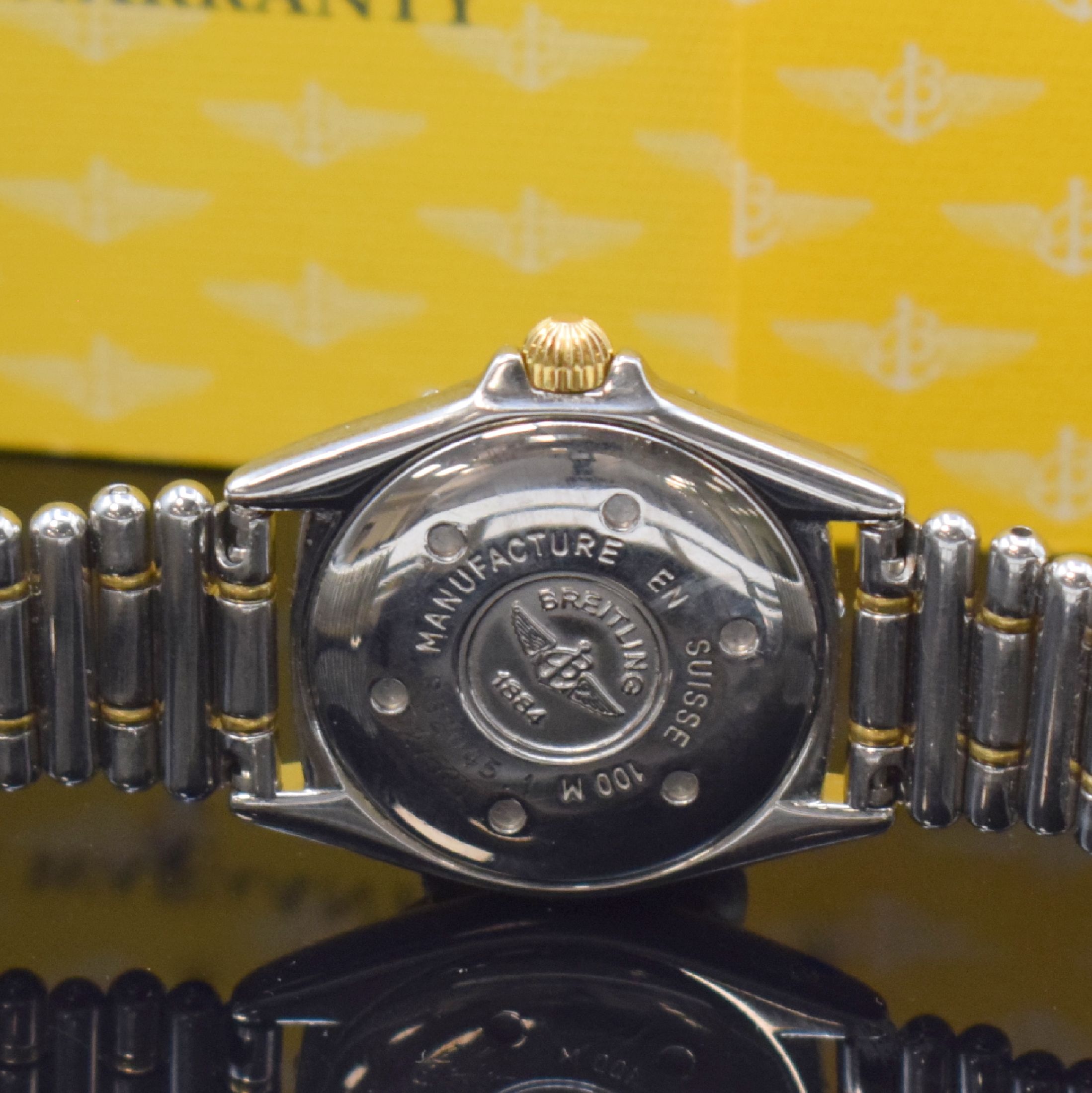 Detail d: BREITLING Damenarmbanduhr Serie Callistino Referenz B 52045, Schweiz verk. lt. beil. Garantie 06/1999, quarz, Edelstahl/Gold komb. inkl. Roleauxband ...