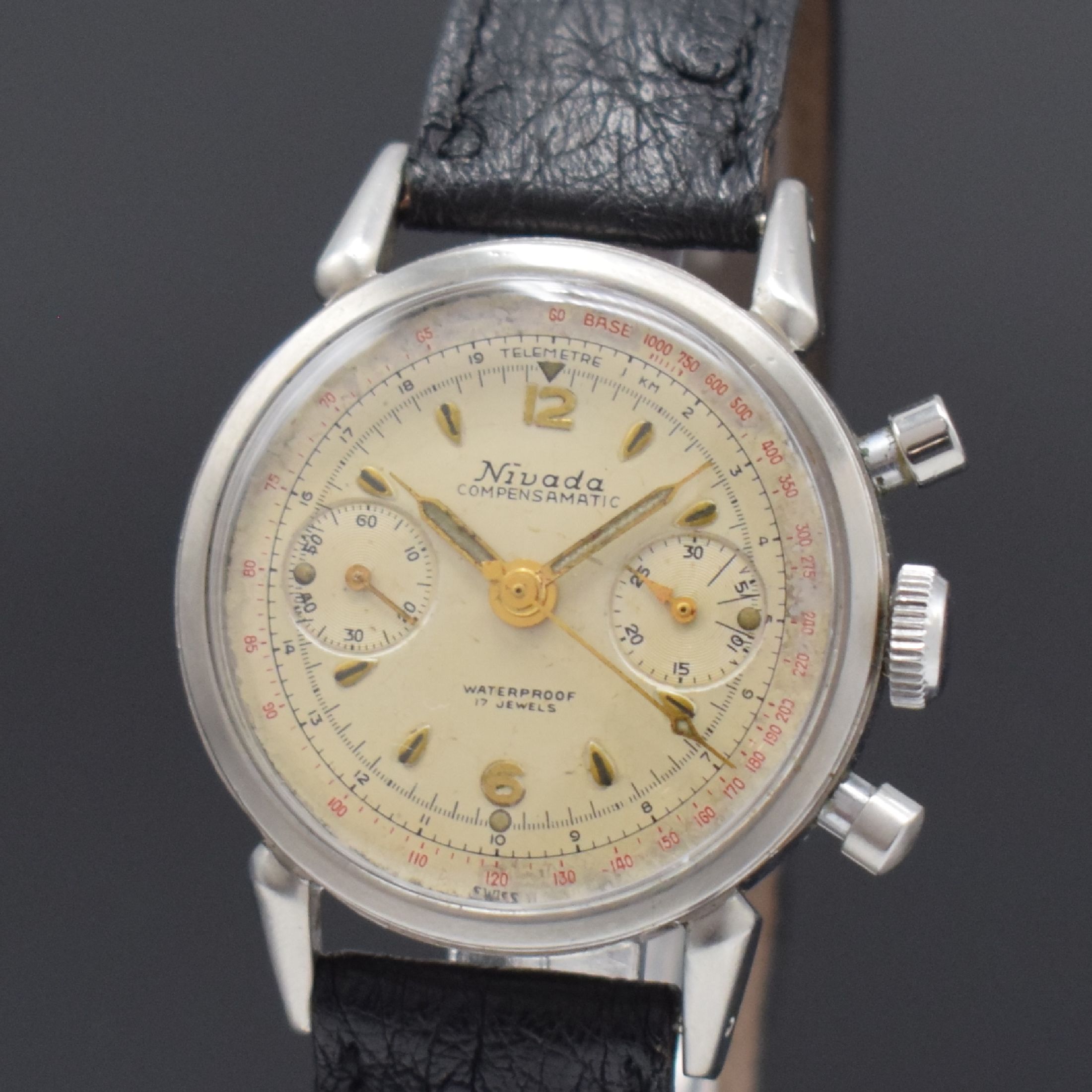 Detail a: NIVADA Schaltrad Herrenchronograph Compensamatic in Stahl, Schweiz um 1955, Handaufzug, verschr. Boden m. Bezeichnung LAMONT, silb. Zifferbl. fl., ...