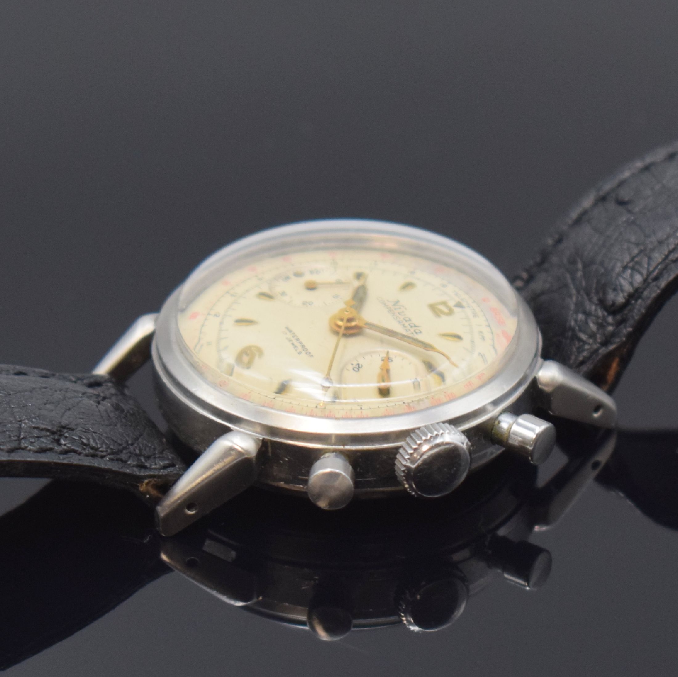 Detail b: NIVADA Schaltrad Herrenchronograph Compensamatic in Stahl, Schweiz um 1955, Handaufzug, verschr. Boden m. Bezeichnung LAMONT, silb. Zifferbl. fl., ...