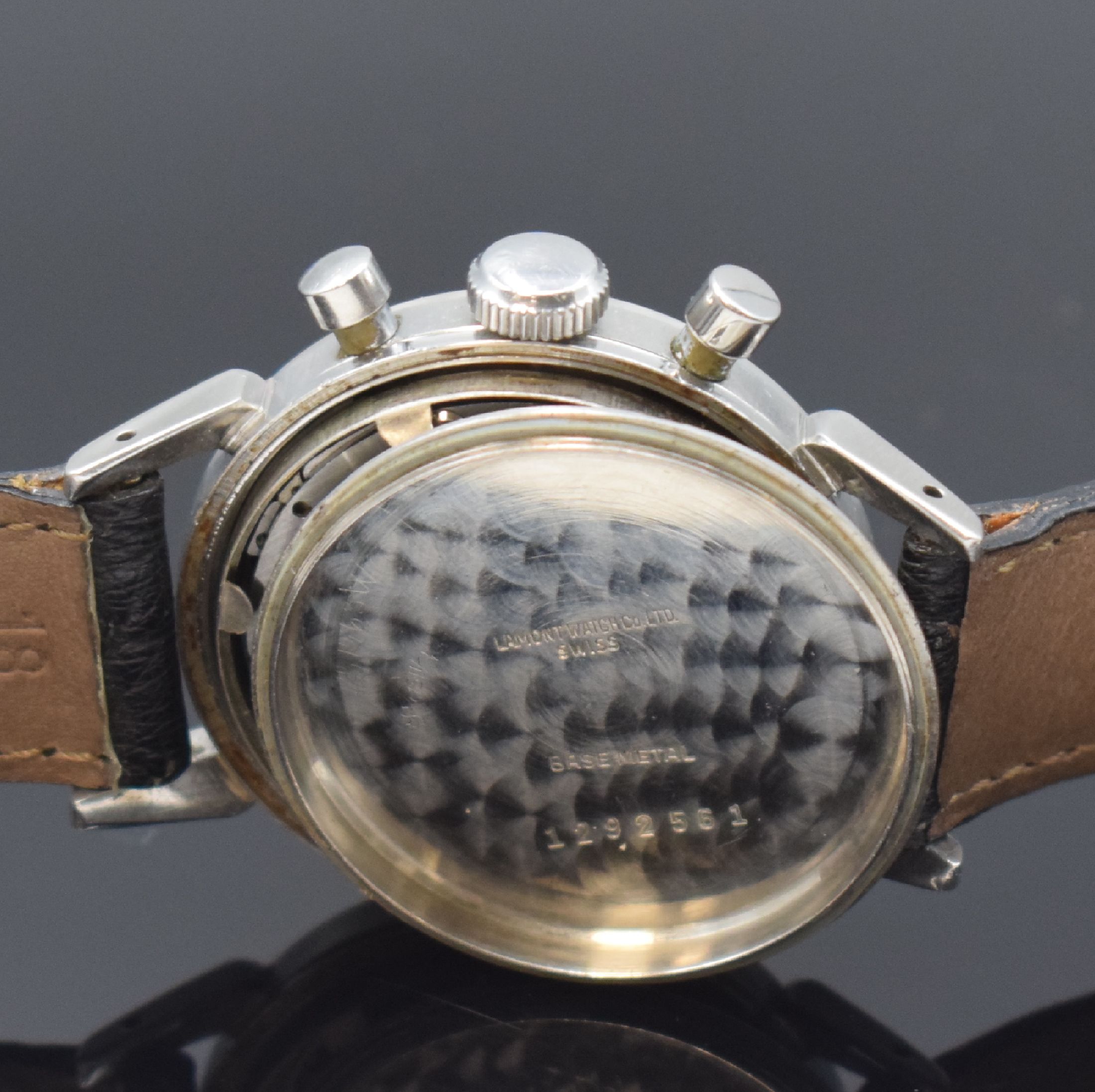 Detail e: NIVADA Schaltrad Herrenchronograph Compensamatic in Stahl, Schweiz um 1955, Handaufzug, verschr. Boden m. Bezeichnung LAMONT, silb. Zifferbl. fl., ...