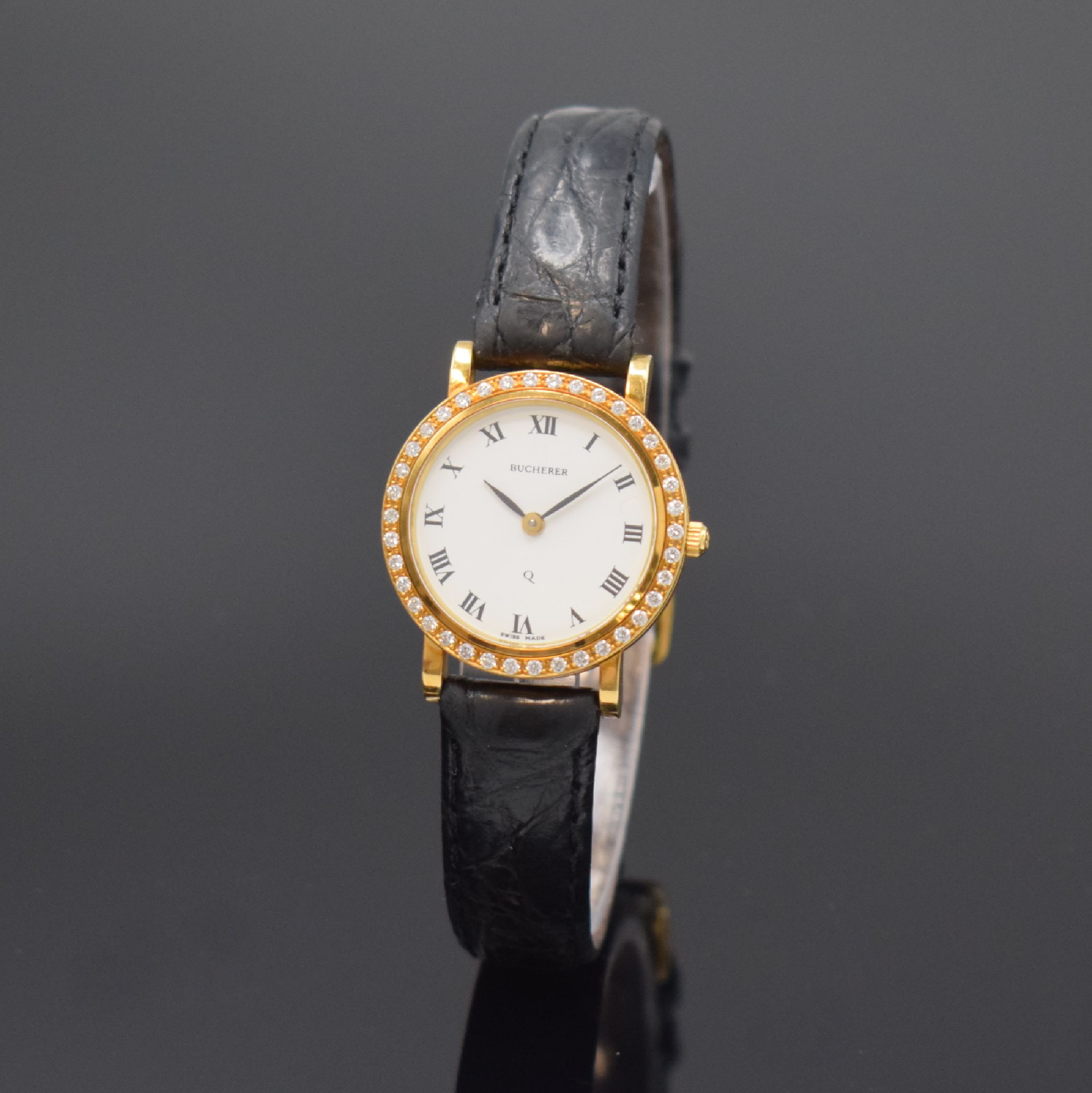 BUCHERER Damenarmbanduhr in GG 750/000 mit Brillantlünette, quarz, Schweiz um 2000, Boden 4-fach verschr., orig. Lederband m. verg. orig. Dornschl., ...