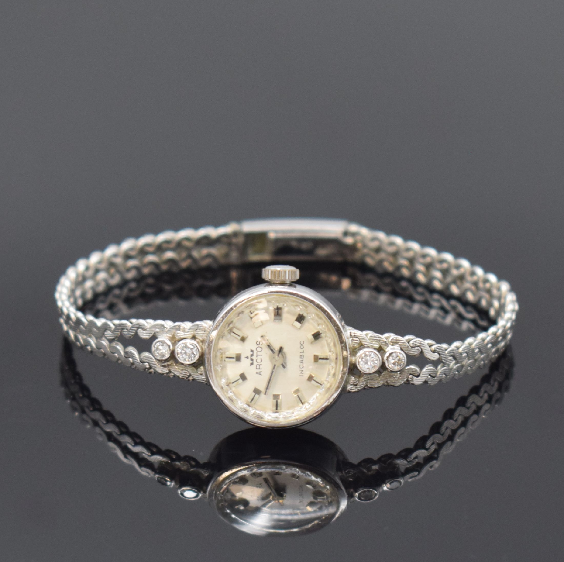 Damen Schmuckuhr in WG 585/000 bezeichnet Arctos, Deutschland um 1970, auf quarz umgerüstet, Boden aufgedr., Band zum Geh. m. 4 Diamanten bes., Anz. ...