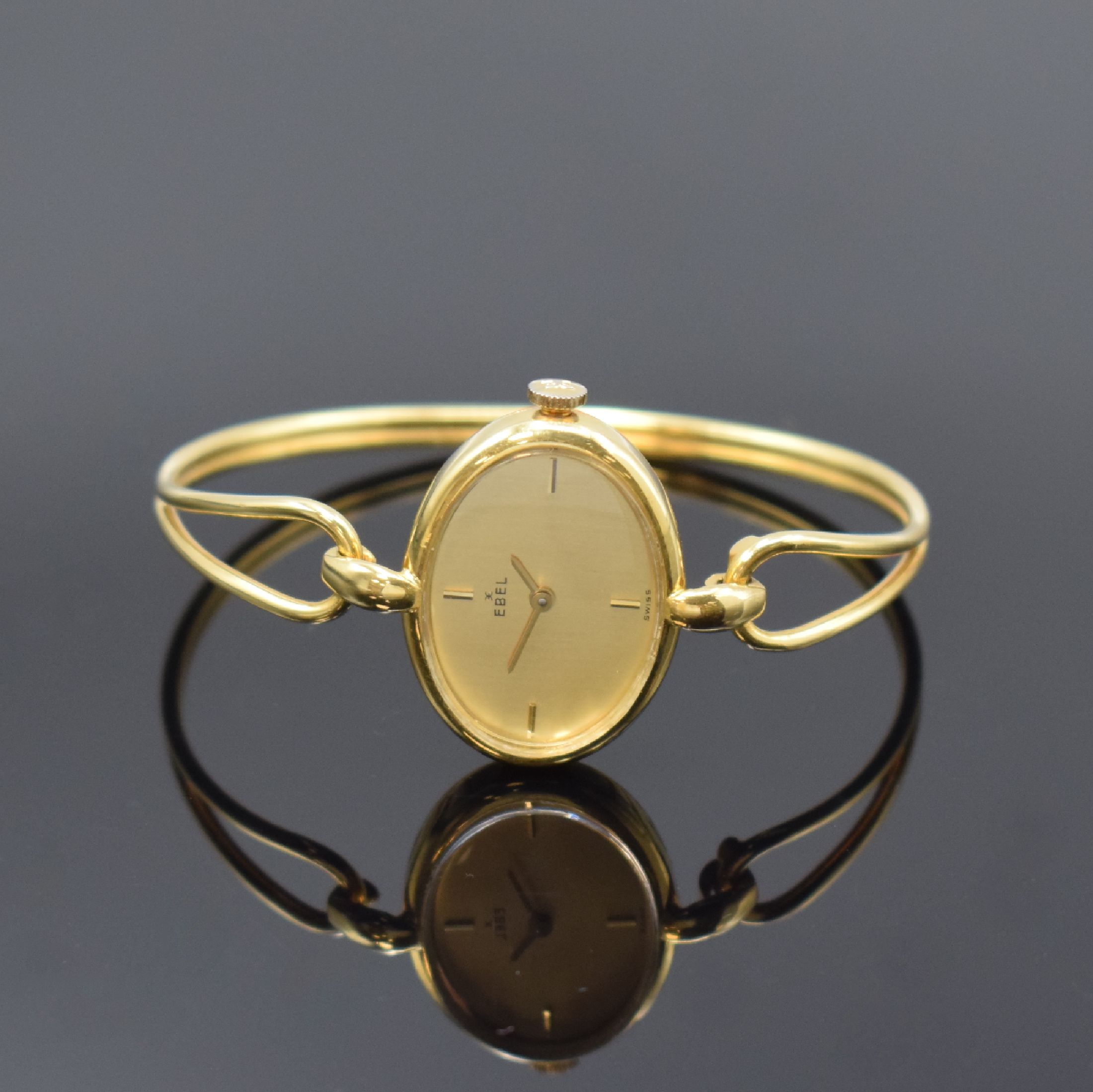 EBEL Damenarmbanduhr in GG 750/000, Handaufzug, Schweiz um 1970, neutr. 2-teil. Geh. an Goldspange, Boden aufgedr., gold. Zifferbl. m. 4 aufgel. ...