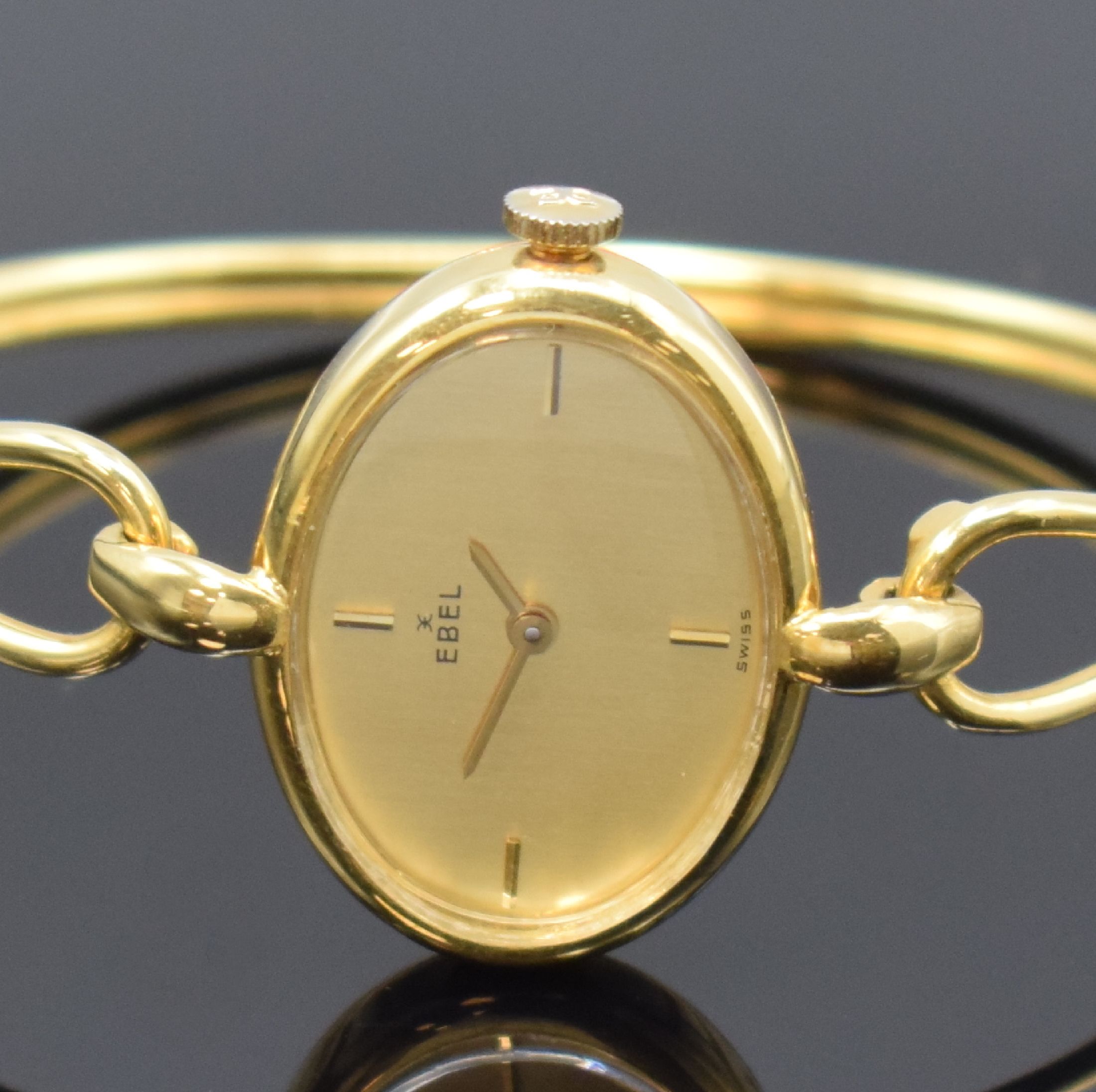 Detail a: EBEL Damenarmbanduhr in GG 750/000, Handaufzug, Schweiz um 1970, neutr. 2-teil. Geh. an Goldspange, Boden aufgedr., gold. Zifferbl. m. 4 aufgel. ...