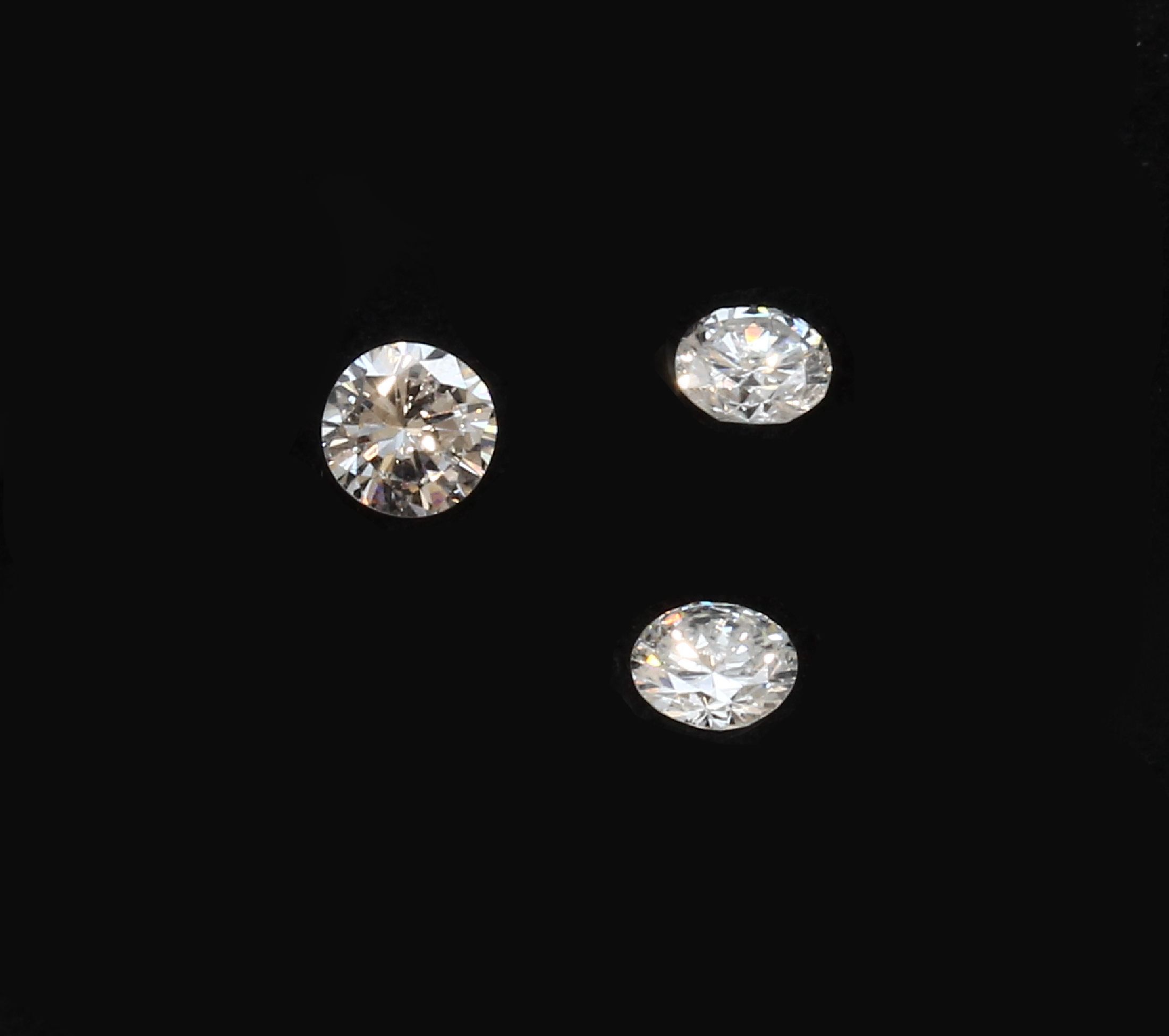 Detail a: Lot 3 lose Brillanten, ca. 0.64 ct Weiß/vs-si