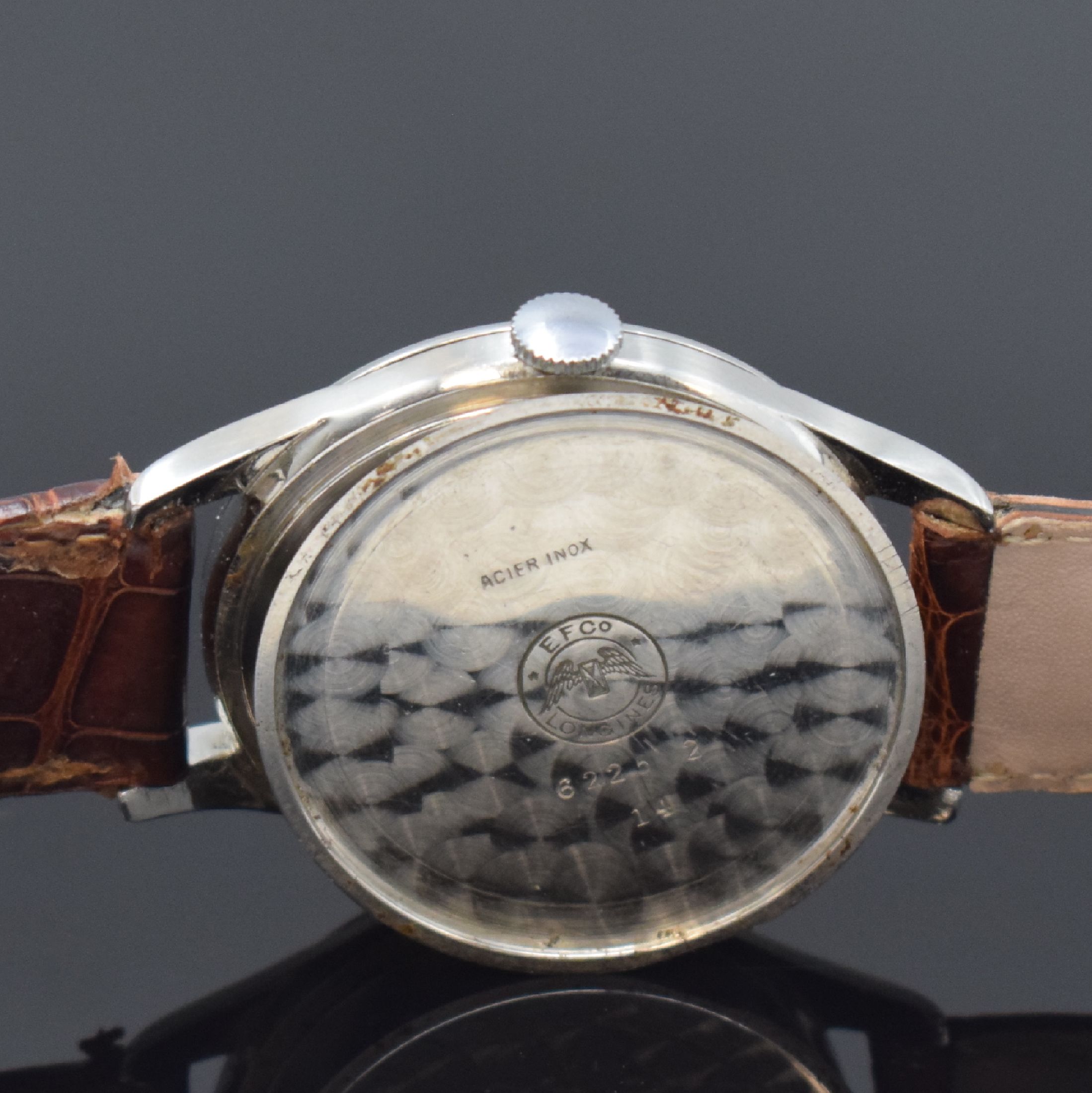Detail e: LONGINES große Herrenarmbanduhr in Stahl, Schweiz um 1959, Handaufzug, 3-tlg. Geh., Boden u. Glasrand aufgedr., silb. Zifferbl. pat., rotgold. ...
