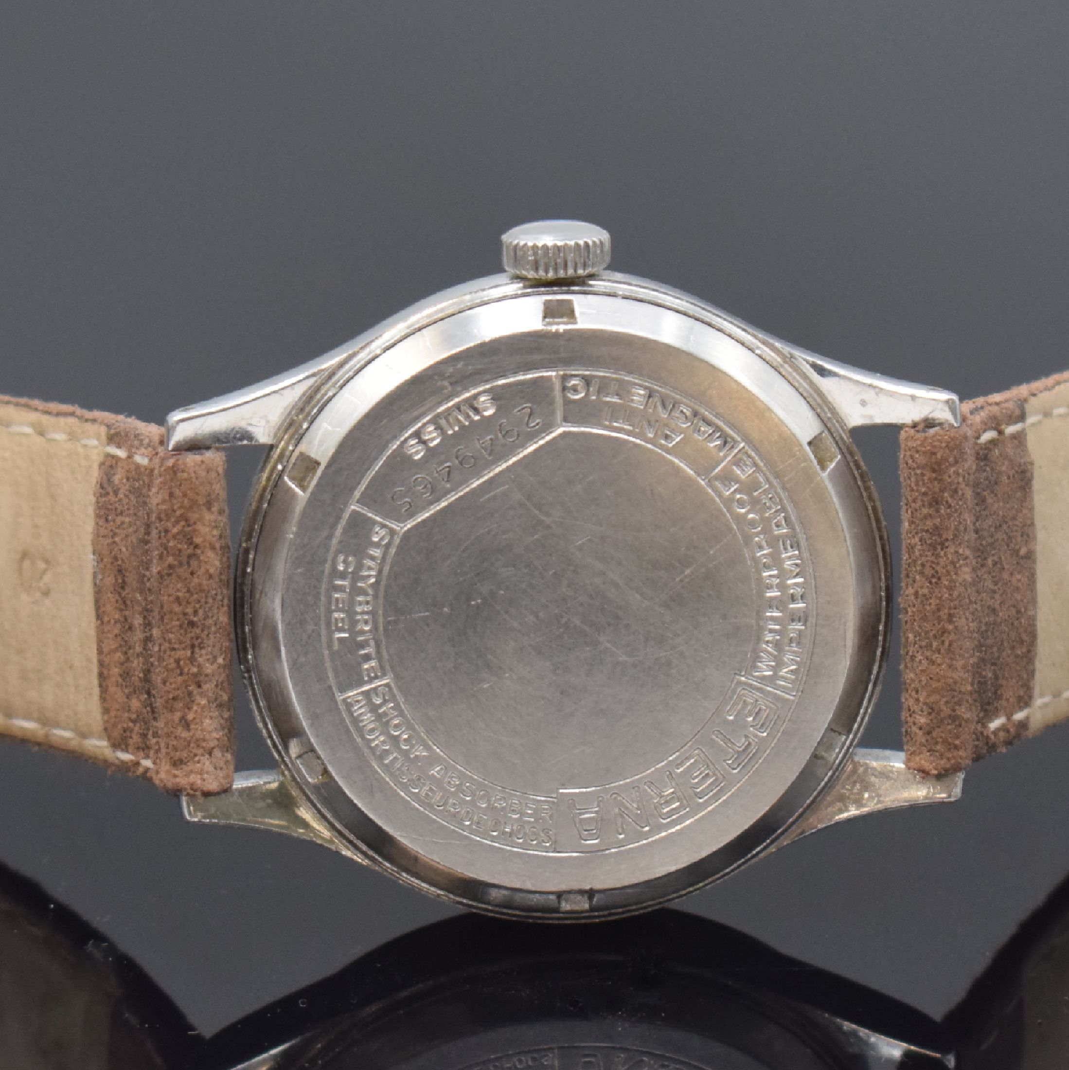 Detail c: ETERNA seltene große Herrenarmbanduhr in Stahl, Schweiz um 1950, Handaufzug, verschr. Geh., silb. Zifferbl. pat., röm. Leucht- zahlen, gold. ...