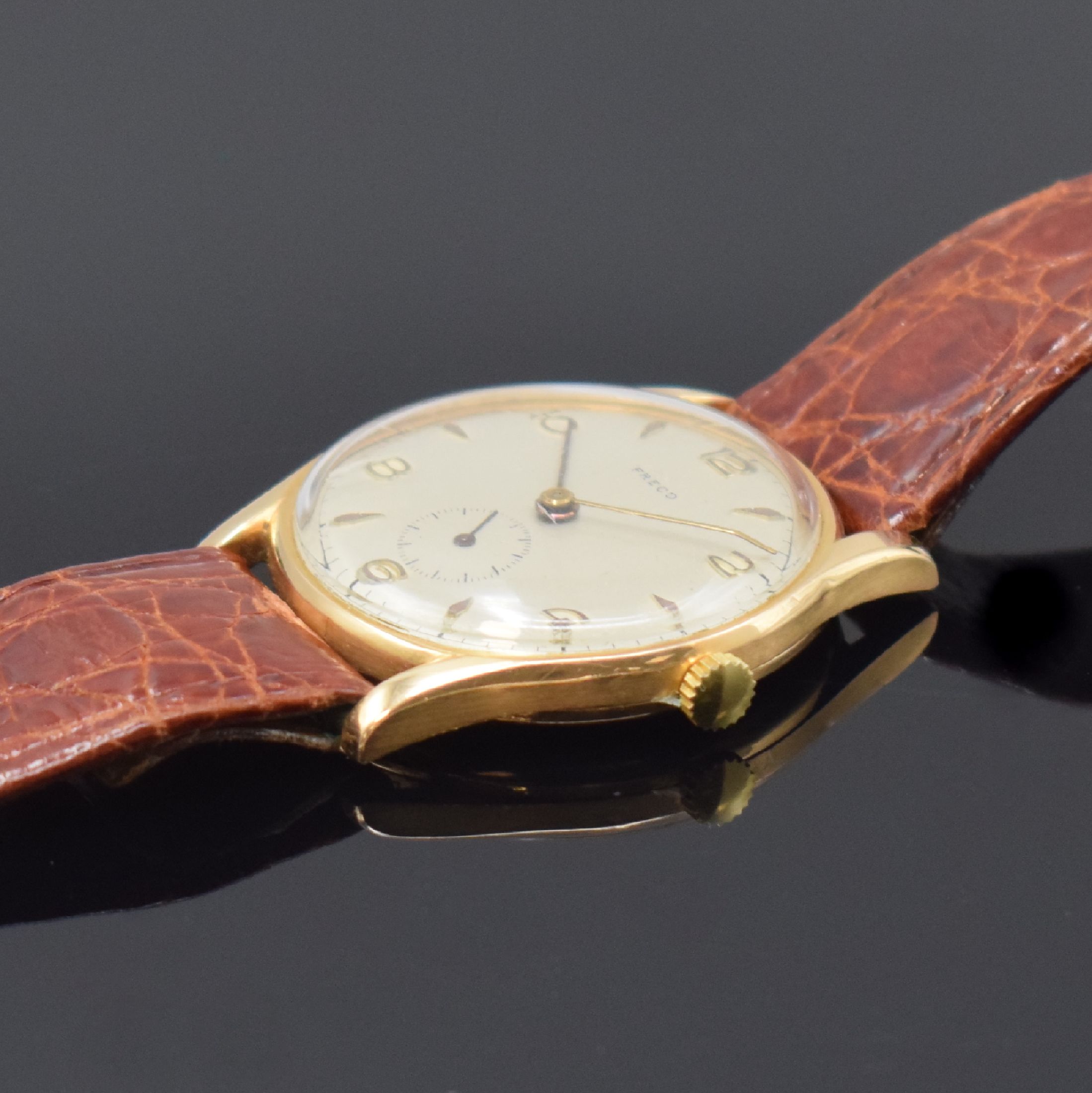 Detail b: FRECO Armbanduhr in RoseG 750/000, Schweiz um 1950, Handaufzug, 2-teil. Gehäuse, Boden aufgedr., silb. rest. Zifferbl. m. aufges., gold. Std.-Ind., ...