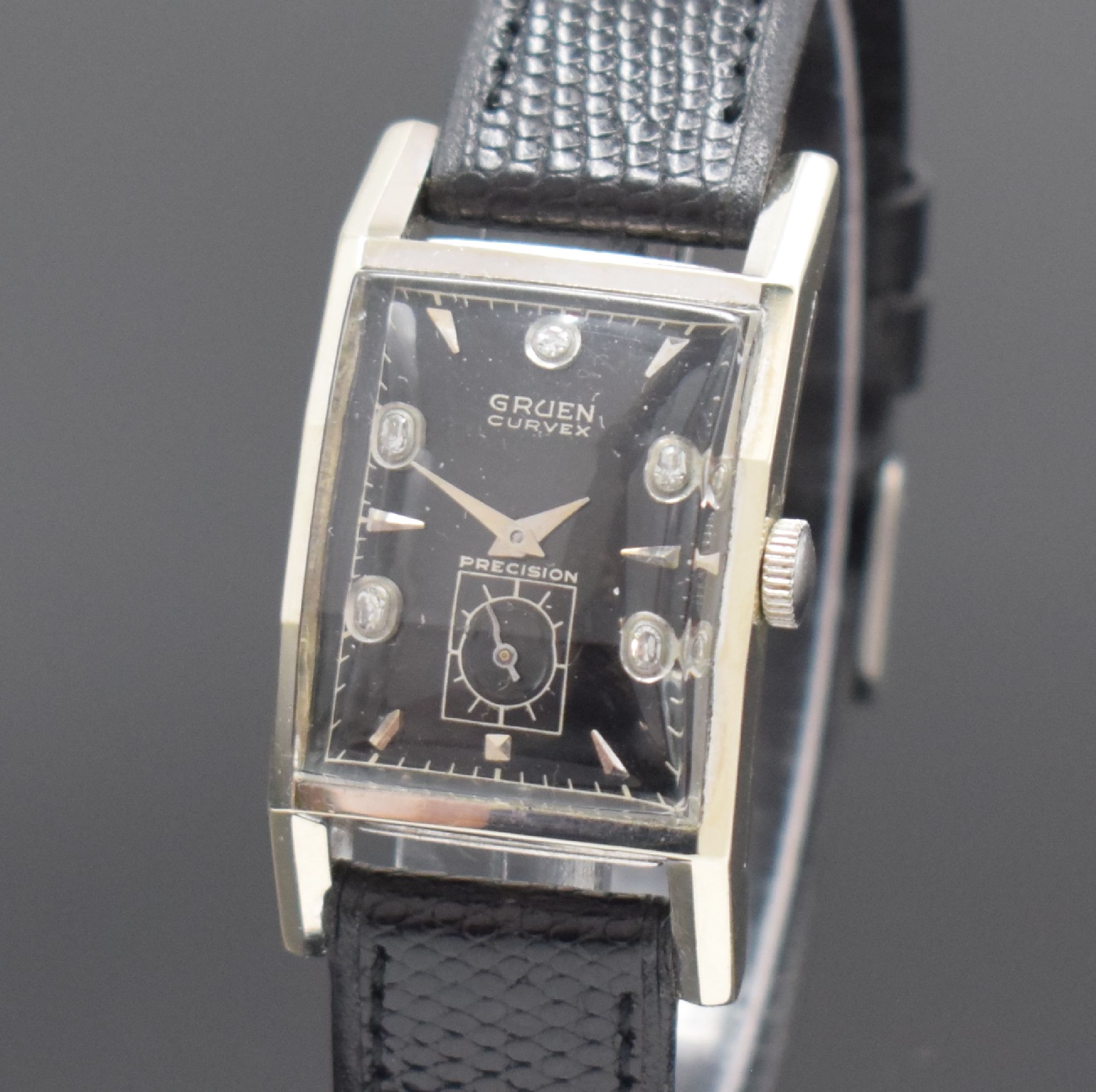 Detail a: GRUEN Curvex Armbanduhr Referenz 370-615 in WG 585/000, Schweiz/USA um 1948, Handaufzug, 2-teil. gewölbtes Geh., gewölbtes u. facett. Glas, Boden ...