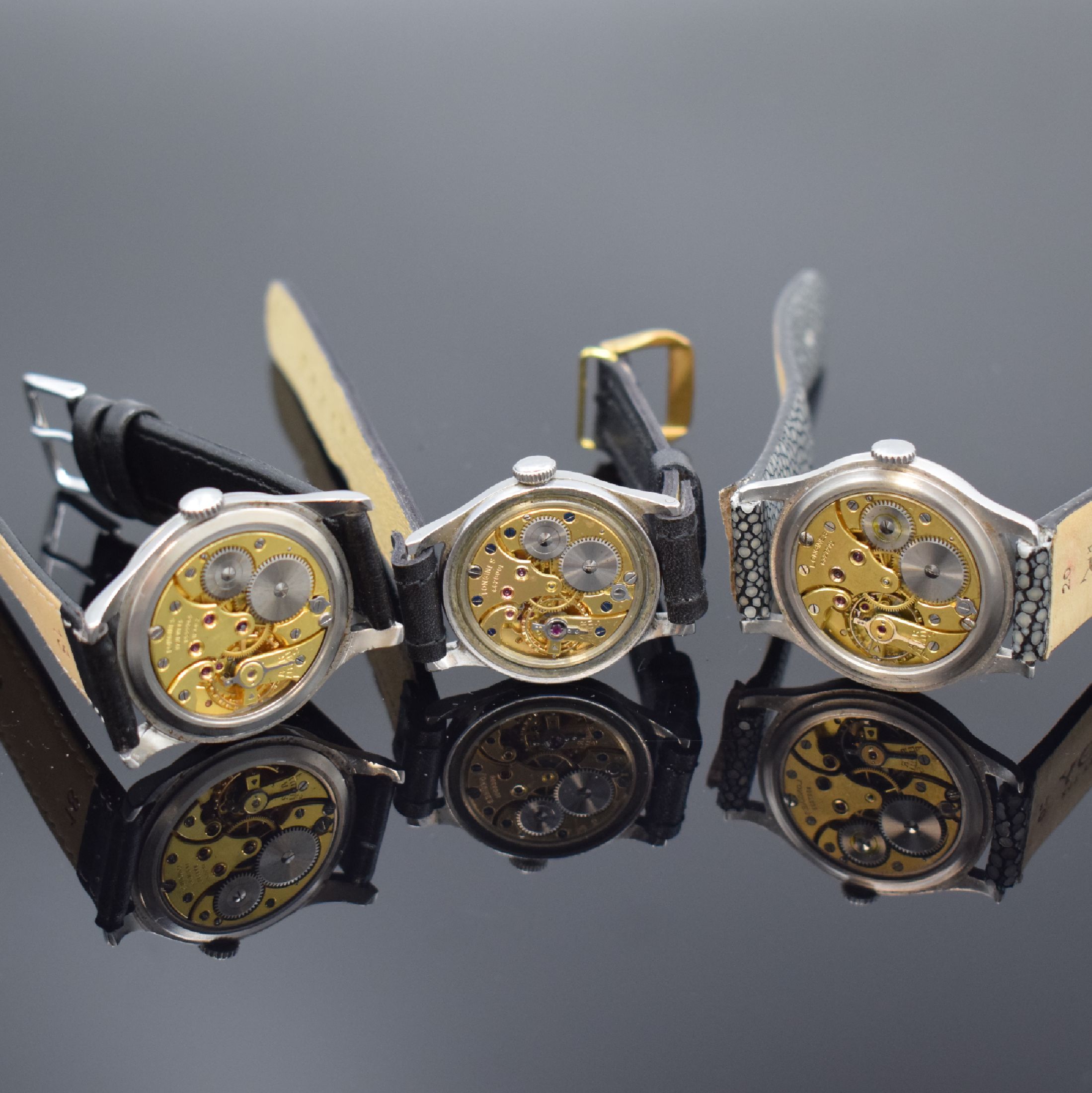 Detail e: LONGINES 3 Armbanduhren in Stahl, Schweiz ca. 1942-1953, verg. Werke, 1) gedr. Geh., Zifferbl. rest., Kaliber 12.68Z, 15 Steine, Komp.-Unruh, D. ca. ...