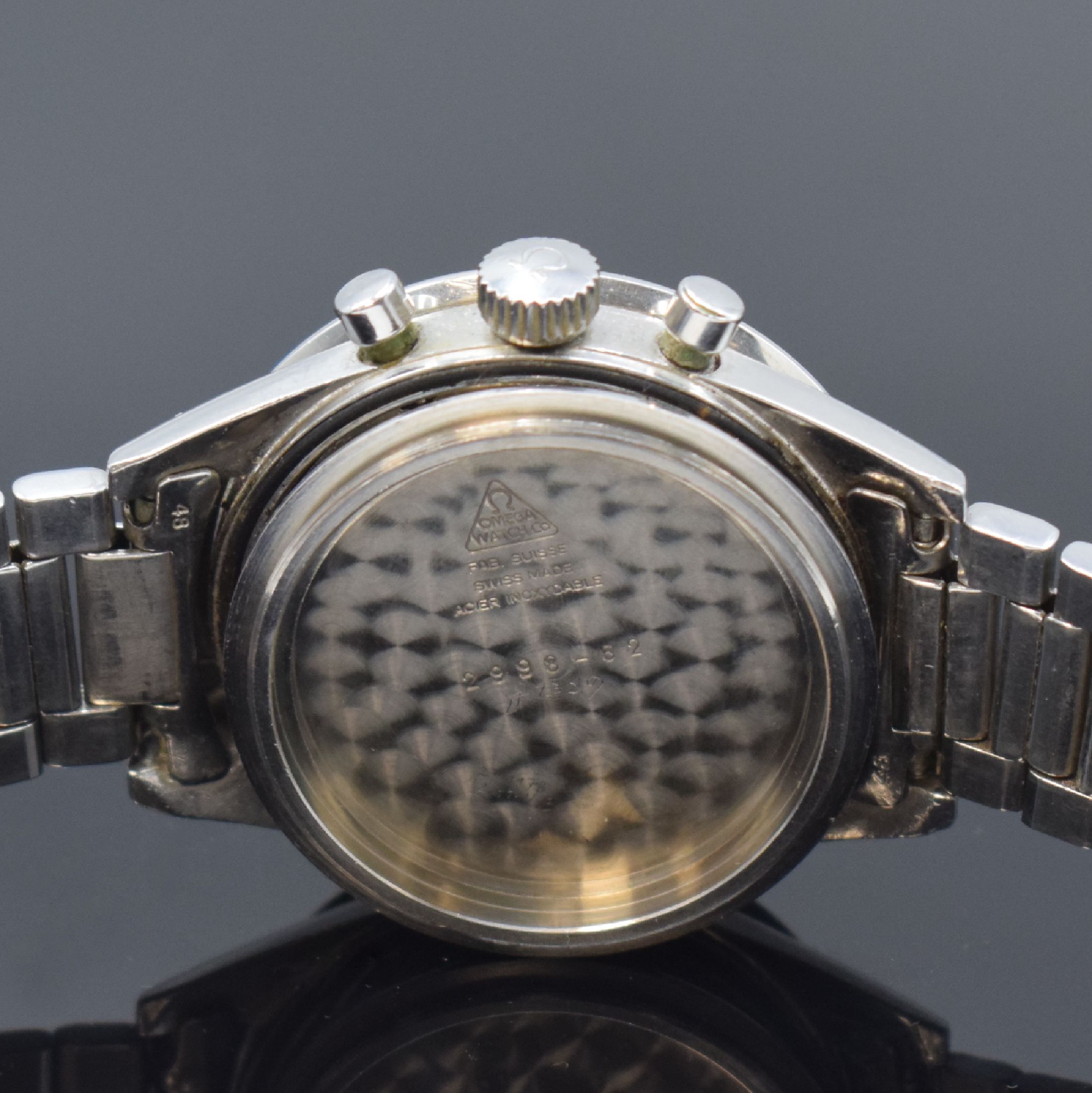 Detail k: OMEGA Speedmaster Herrenchronograph Referenz 2998, Schweiz um 1962, Handaufzug, Stahlgeh., Boden verschr., orig. Omega Stahlband (Anstoß-Nr. 48) m. ...