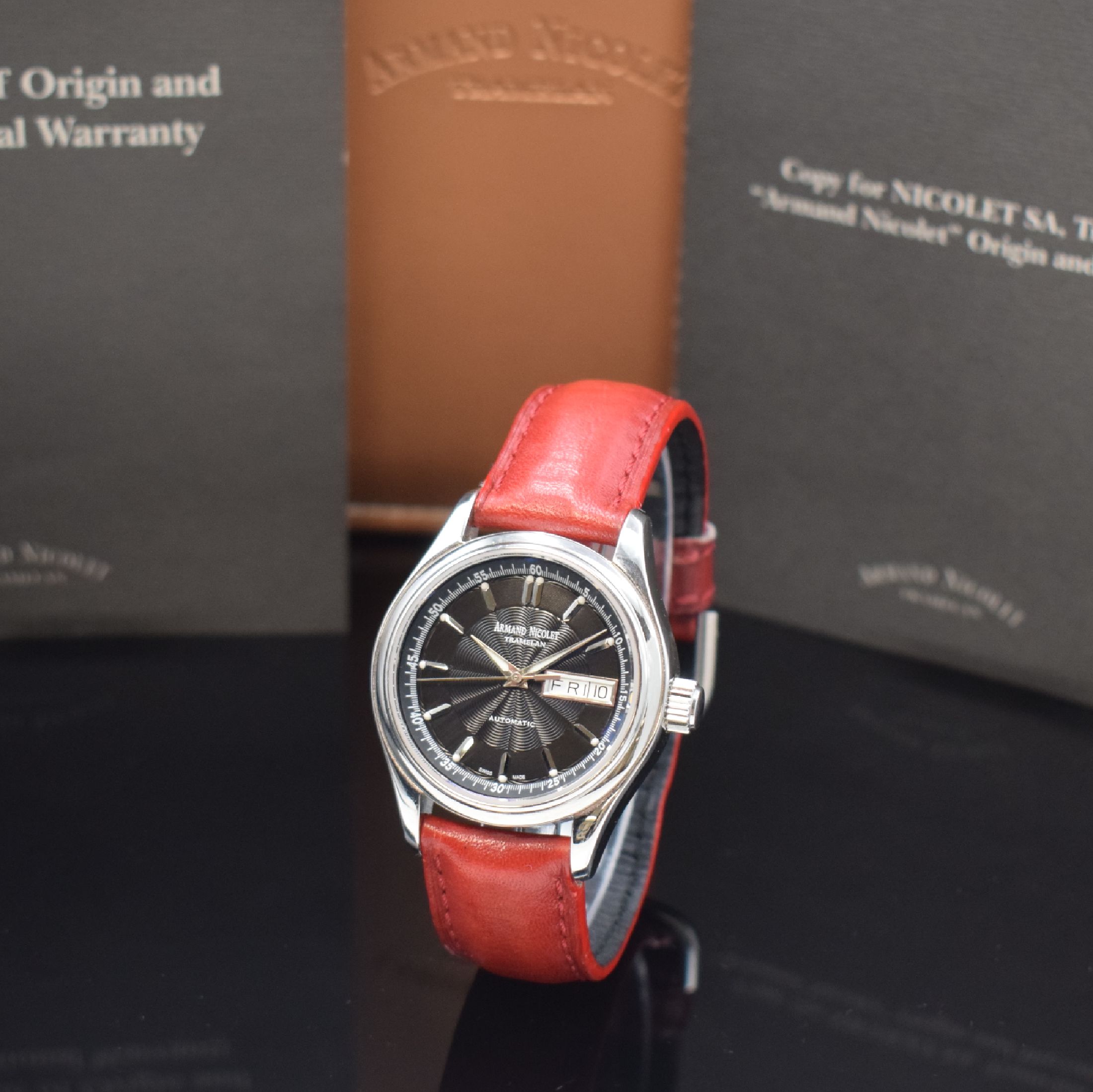 ARMAND NICOLET Tramelan Herrenarmbanduhr in Stahl, Schweiz um 2020, Automatik, pol. Geh.m. Saphirglas, Boden u. Krone verschr., guill. schwarzes ...