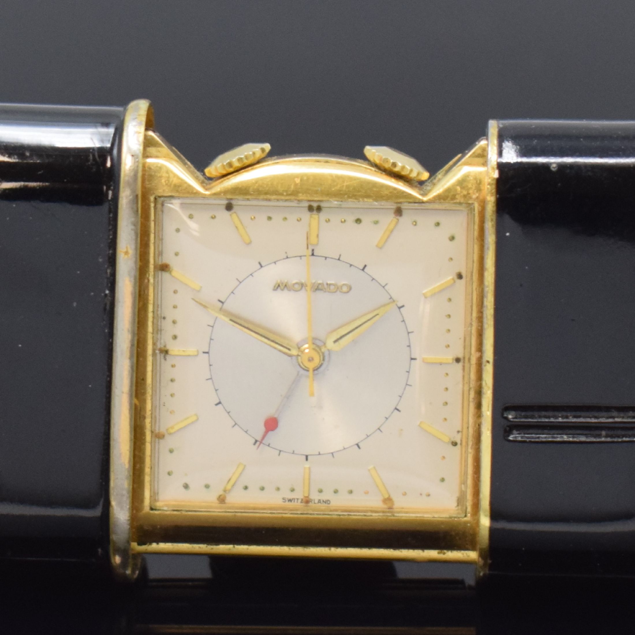 Detail a: MOVADO Ermetophon vergoldeter Taschenwecker, Schweiz um 1950, Schiebeaufzug, verg. Geh. m. aufstellbarem Bügel, Kapsel später schwarz lackiert, ...