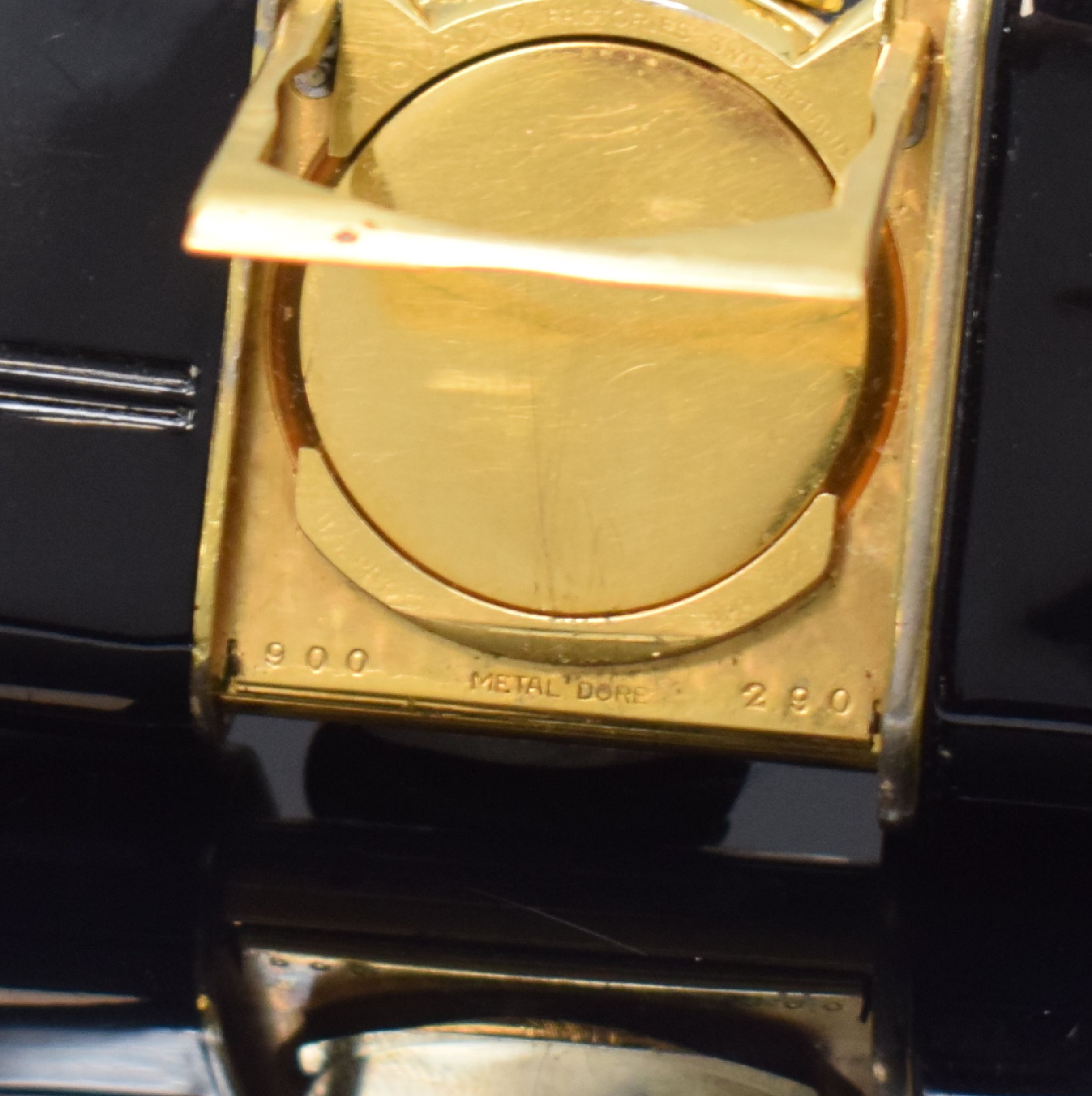 Detail c: MOVADO Ermetophon vergoldeter Taschenwecker, Schweiz um 1950, Schiebeaufzug, verg. Geh. m. aufstellbarem Bügel, Kapsel später schwarz lackiert, ...