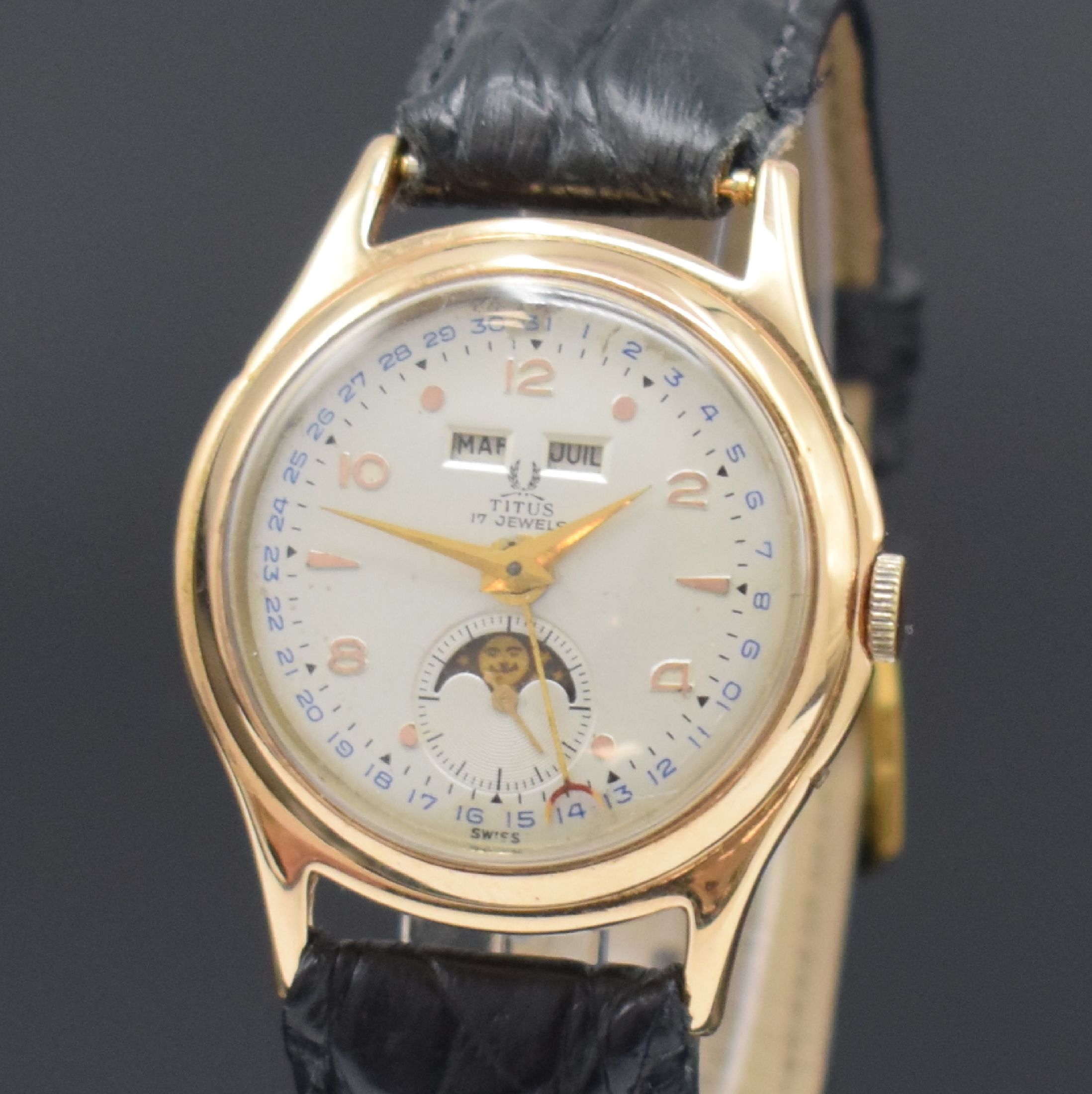 Detail a: TITUS vergoldete Armbanduhr mit Vollkalender Kaliber Venus 203, Schweiz um 1955, Handaufzug, Stahlboden aufgedr., Korrekturdr. seitl. im Geh. ...