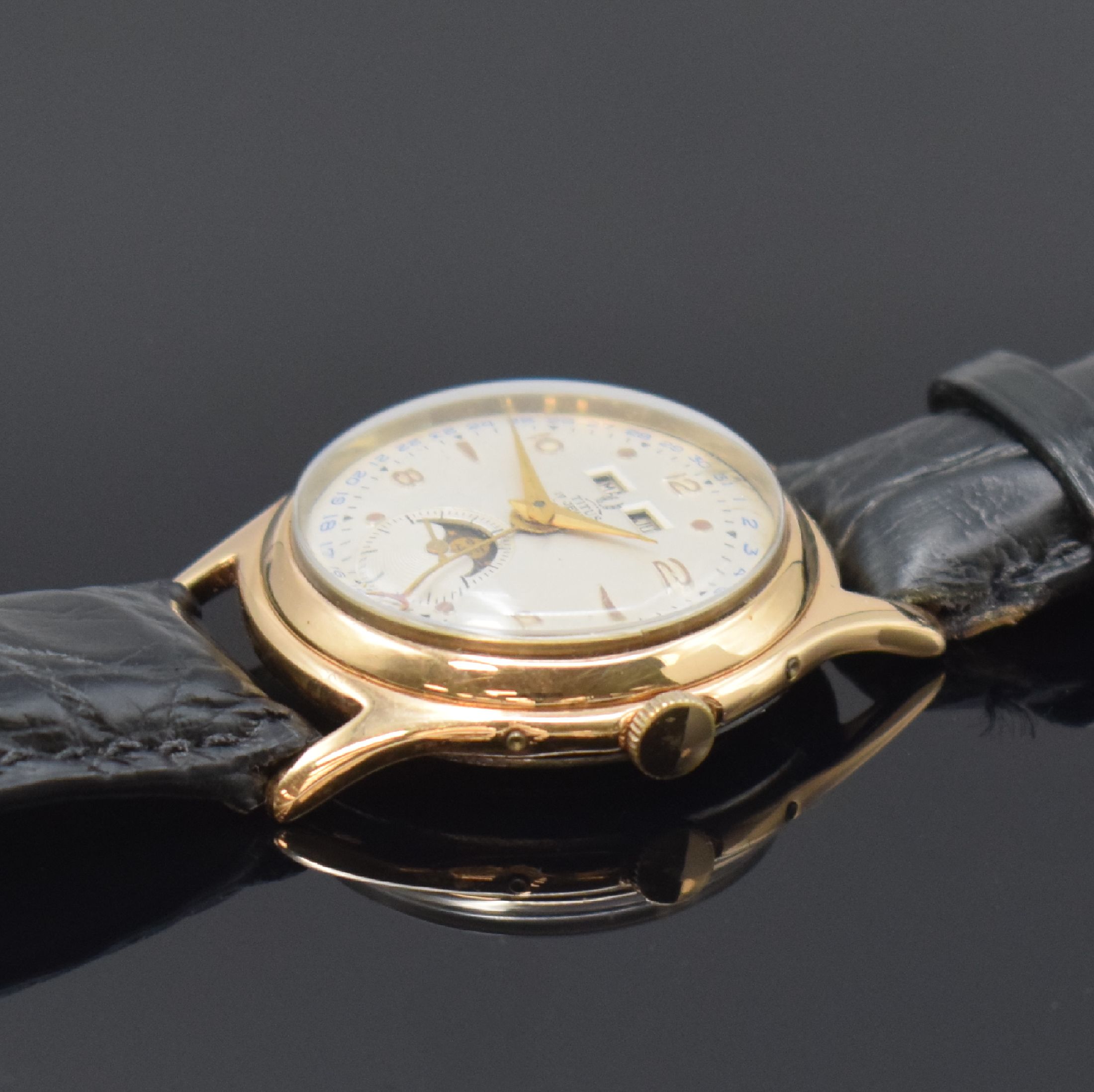 Detail b: TITUS vergoldete Armbanduhr mit Vollkalender Kaliber Venus 203, Schweiz um 1955, Handaufzug, Stahlboden aufgedr., Korrekturdr. seitl. im Geh. ...