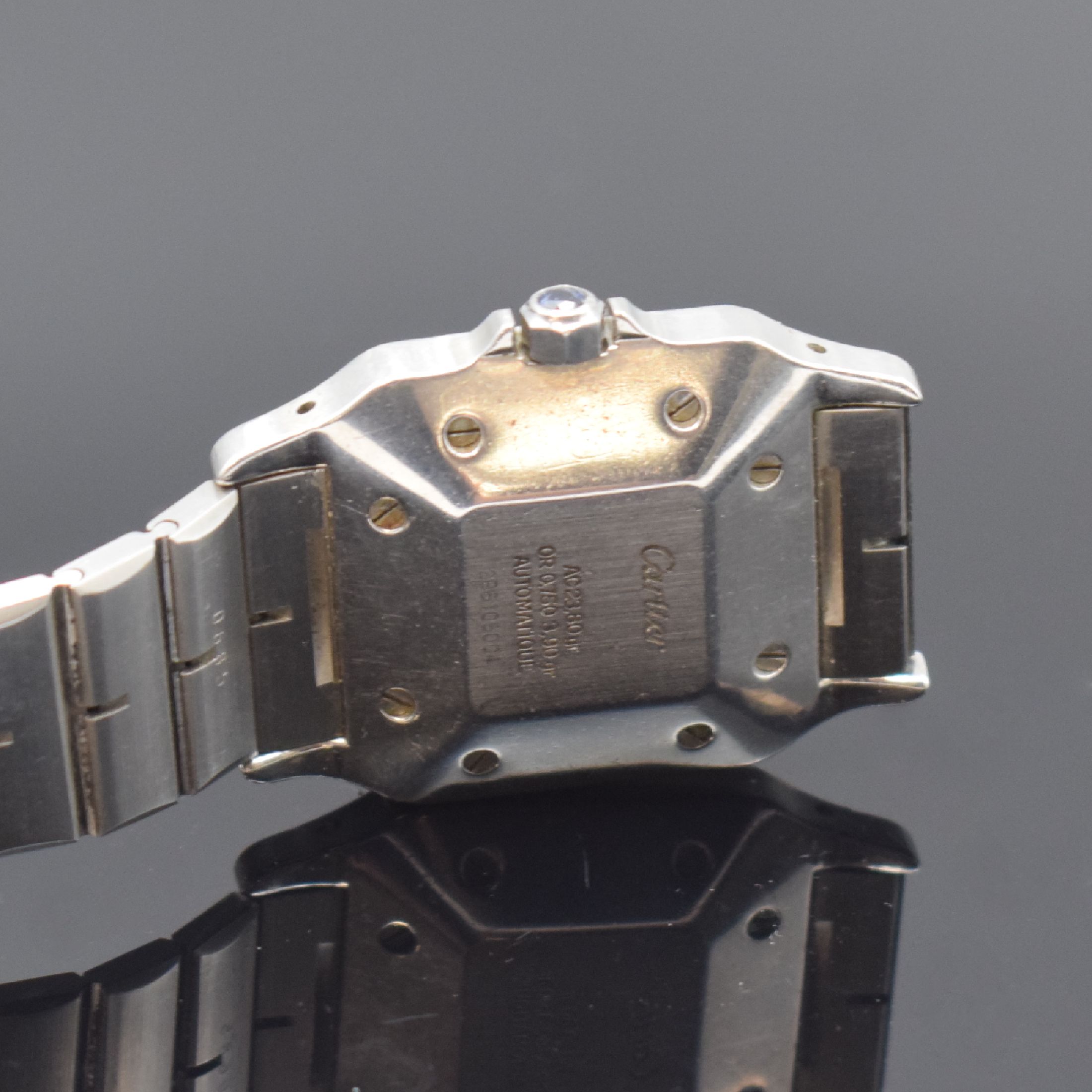 Detail e: CARTIER Santos Herrenarmbanduhr, Schweiz um 1985, Automatik, Edelstahl/Gold kombiniert inkl. Gliederband m. Faltschl., Monocoque- Geh., Lünette ...