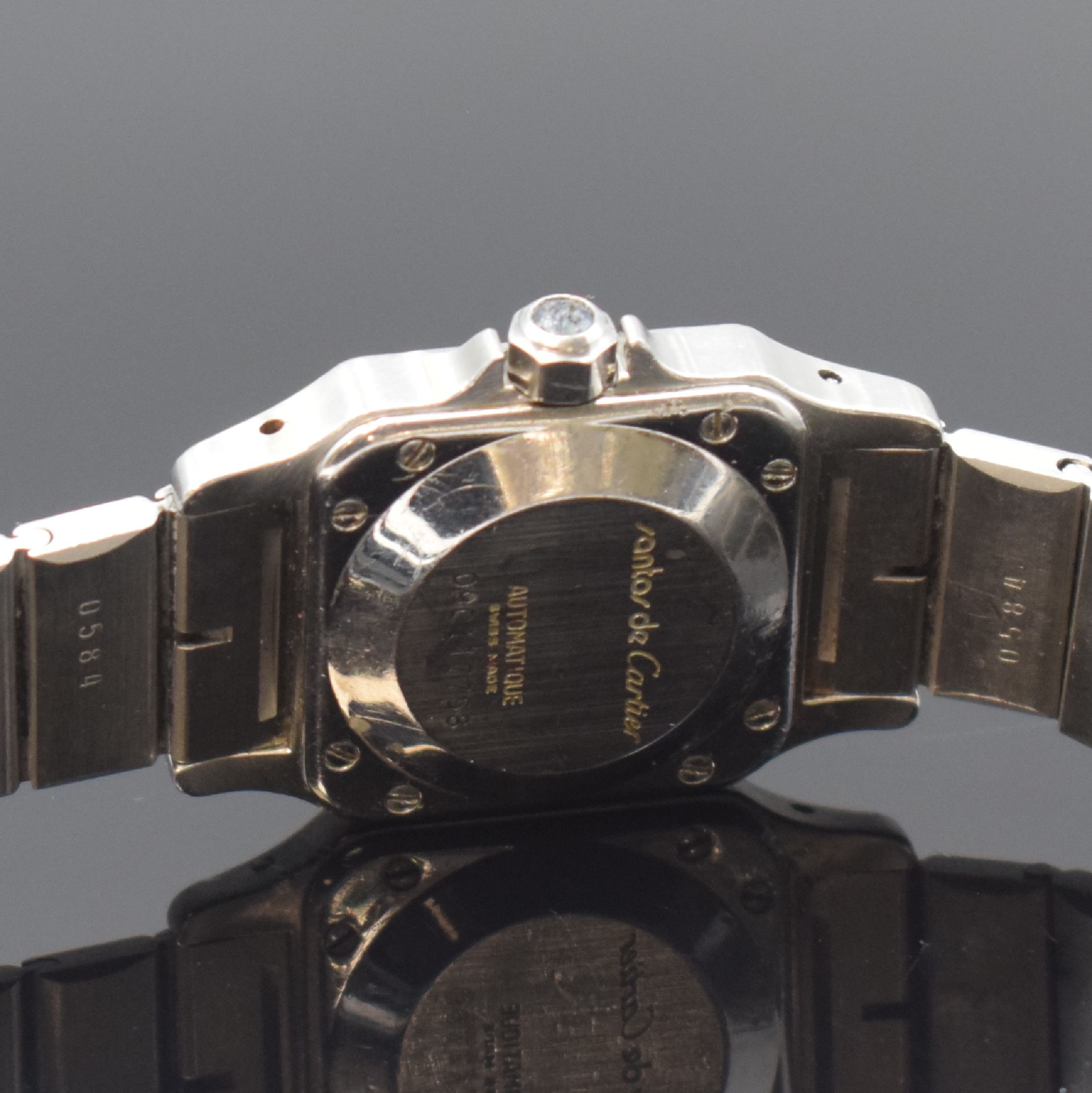 Detail d: CARTIER Santos Damenarmbanduhr in Stahl, Schweiz um 1990, Automatik, Boden u. Lünette 8-fach verschr., Gliederband m. Faltschl., Schmuckkrone ...