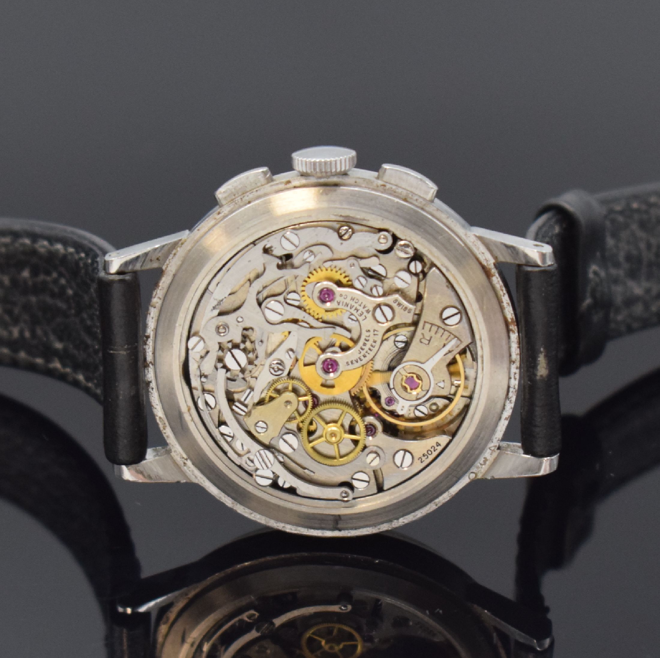 Detail d: LEMANIA Schaltradchronograph in Stahl, Schweiz um 1955, Handaufzug, Boden aufgedr., schwarzes Zifferbl. rest., silb. Std.-Ind. u. arab. Zahlen, ...