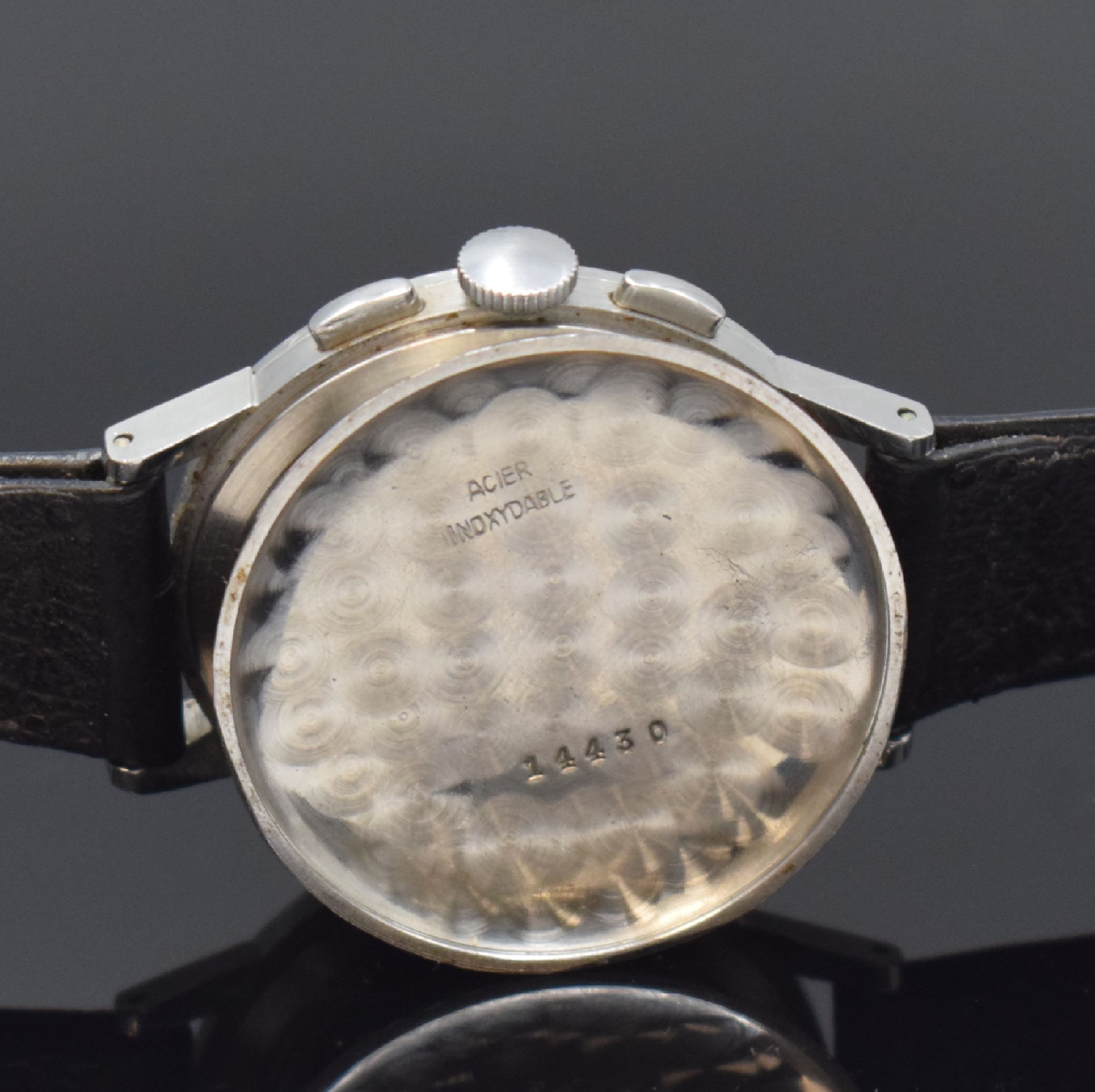 Detail e: LEMANIA Schaltradchronograph in Stahl, Schweiz um 1955, Handaufzug, Boden aufgedr., schwarzes Zifferbl. rest., silb. Std.-Ind. u. arab. Zahlen, ...