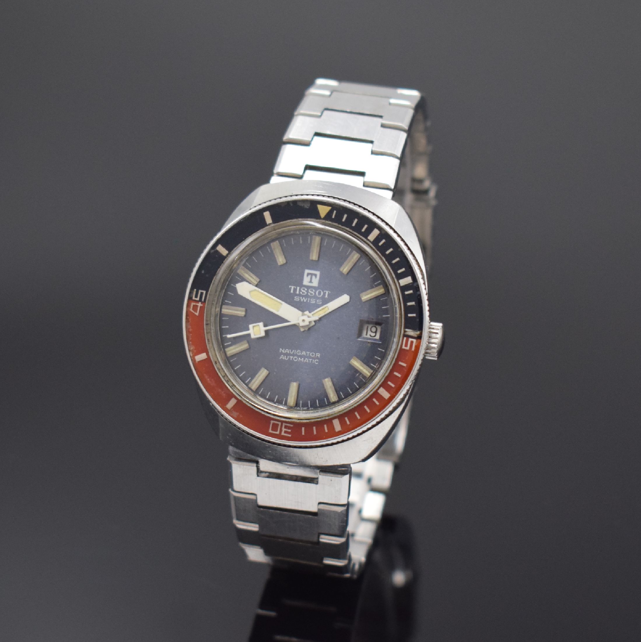 TISSOT Navigator Herrenarmbanduhr, Schweiz um 1975, Automatik, Edelstahlgeh., Boden geschr., orig. Gliederband m. Faltschl., eins. drehb. Lünette, ...
