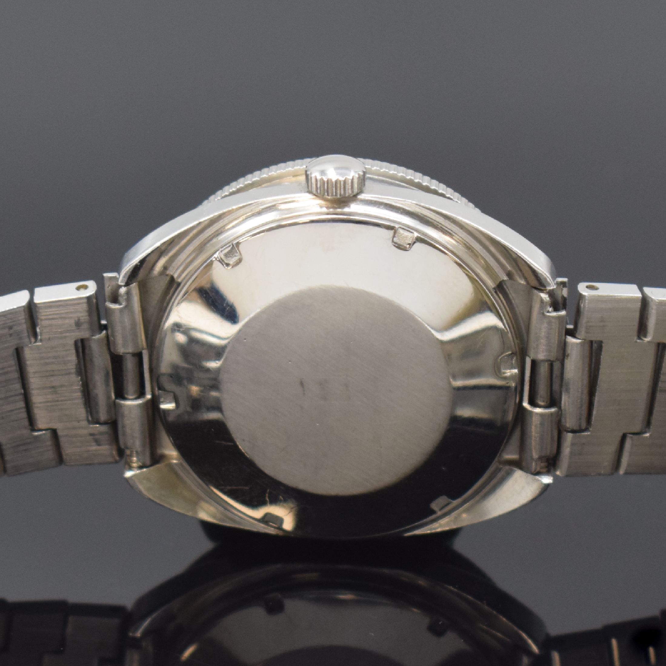 Detail d: TISSOT Navigator Herrenarmbanduhr, Schweiz um 1975, Automatik, Edelstahlgeh., Boden geschr., orig. Gliederband m. Faltschl., eins. drehb. Lünette, ...