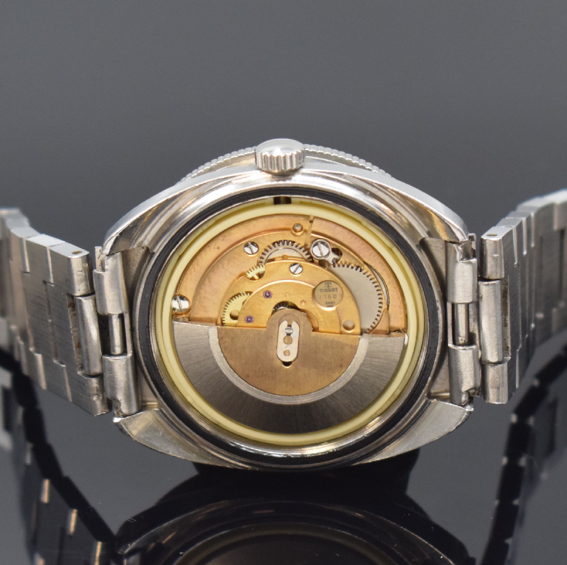 Detail e: TISSOT Navigator Herrenarmbanduhr, Schweiz um 1975, Automatik, Edelstahlgeh., Boden geschr., orig. Gliederband m. Faltschl., eins. drehb. Lünette, ...