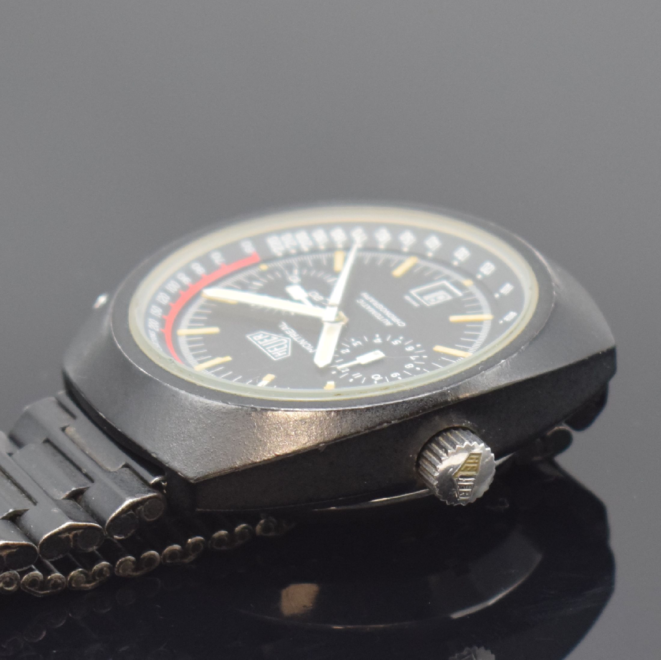 Detail c: HEUER Montreal seltener Armbandchronograph, Schweiz um 1972, Automatik, geschwärztes Stahlgeh. o. Nr. inkl. NSA Gliederband mit Faltschl., verschr. ...