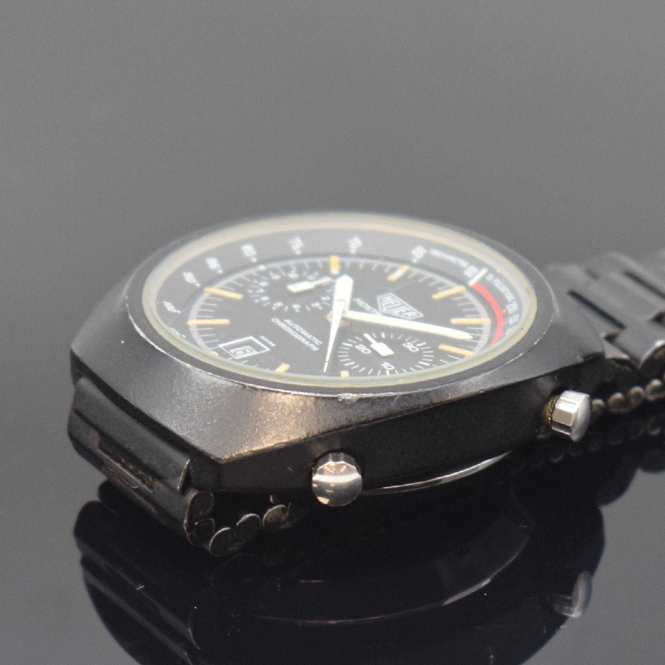 Detail d: HEUER Montreal seltener Armbandchronograph, Schweiz um 1972, Automatik, geschwärztes Stahlgeh. o. Nr. inkl. NSA Gliederband mit Faltschl., verschr. ...