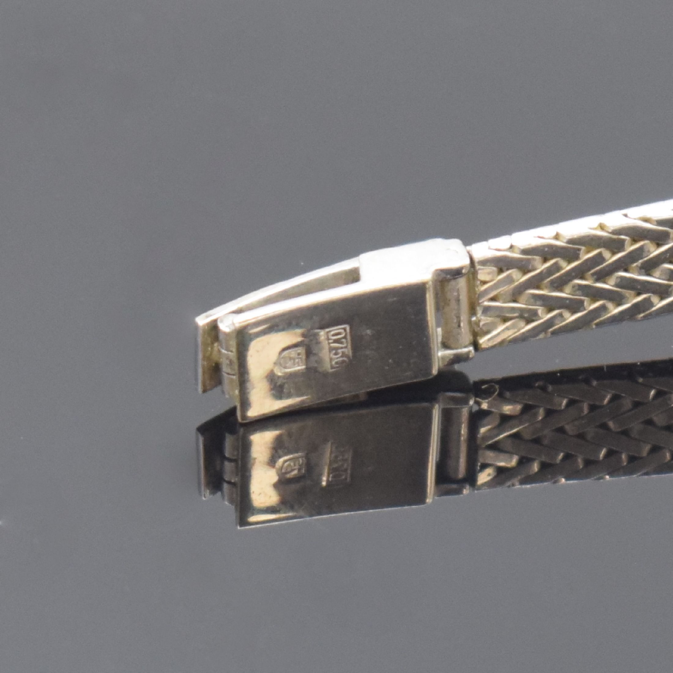 Detail b: EBEL Damenarmbanduhr in WG 750/000 mit Diamanten, Schweiz um 1965, Handaufzug, 2- teil. Geh., Boden aufgedr., silb. Zifferbl. m. aufges. Std.-Ind. ...