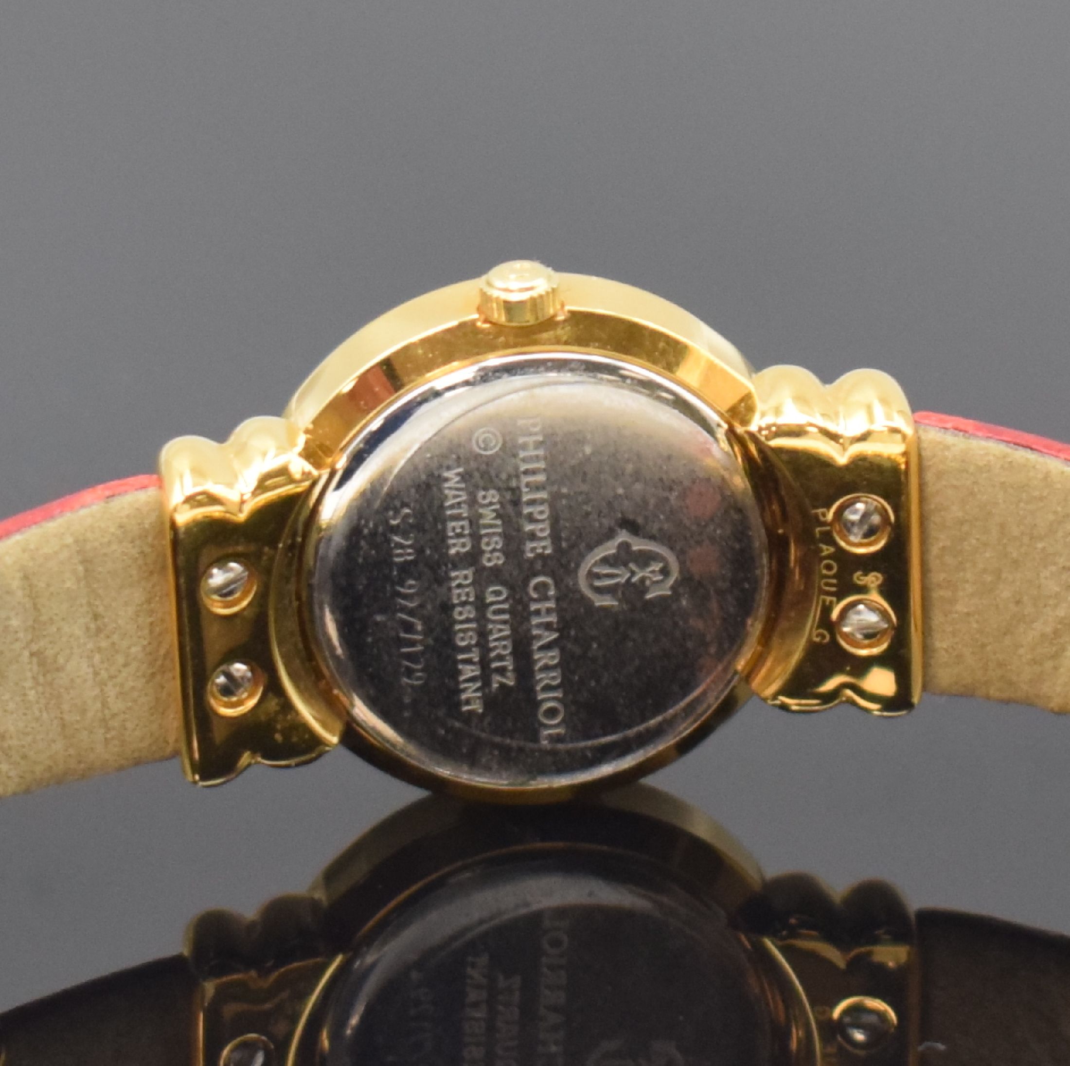 Detail d: PHILIPPE CHARRIOL St. Tropez Damenarmbanduhr Referenz S28.92, Schweiz um 1995, quarz, verg. Gehäuse, Stahlboden aufgedr., orig. Lederband, gold. ...