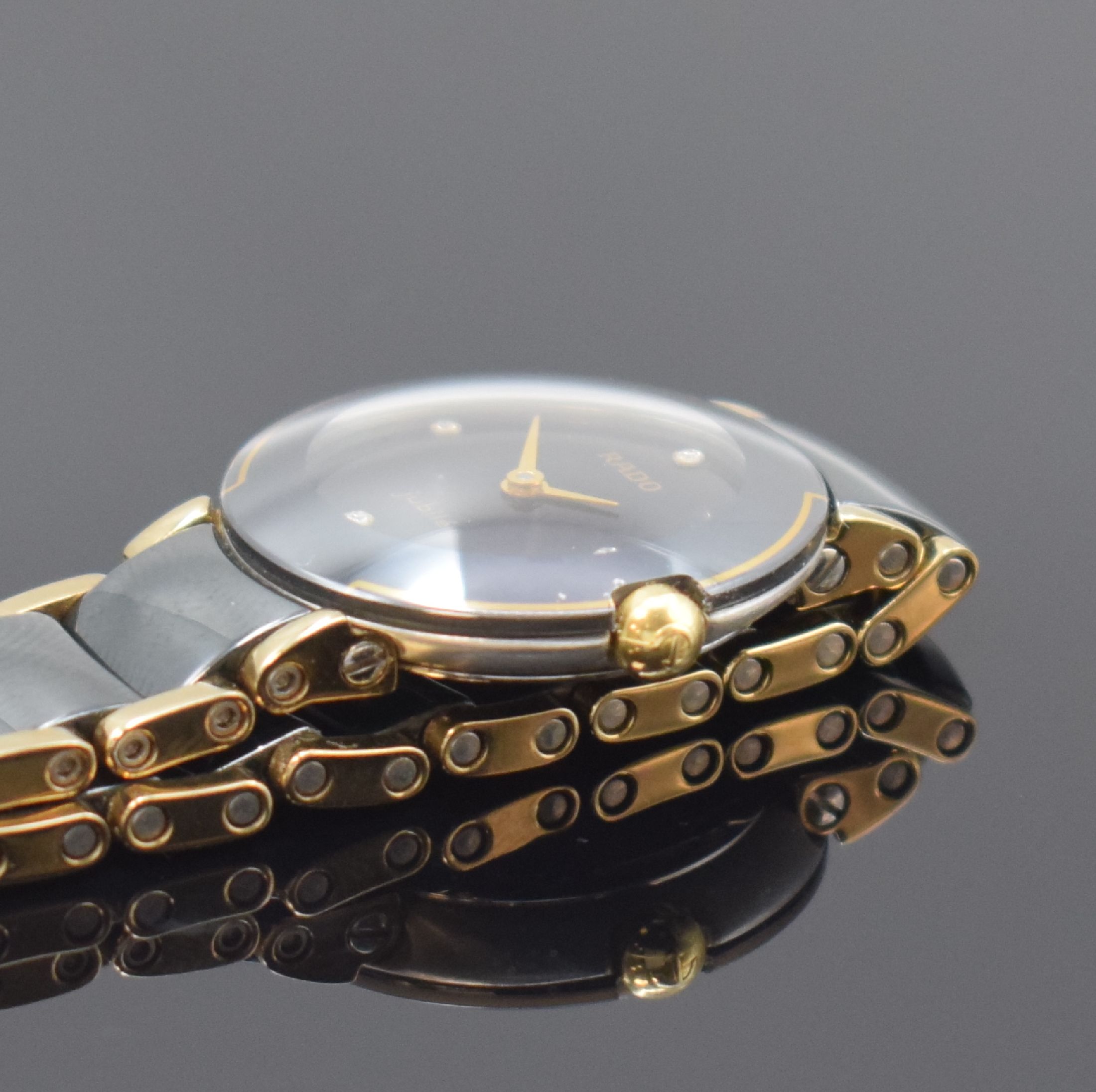 Detail c: RADO Jubile Damenarmbanduhr Referenz 204.0302.3, Schweiz um 2000, quarz, 2-teil. Edelstahlgeh., Boden aufgedr., schwarzes Zifferbl., gold. Zeiger, ...