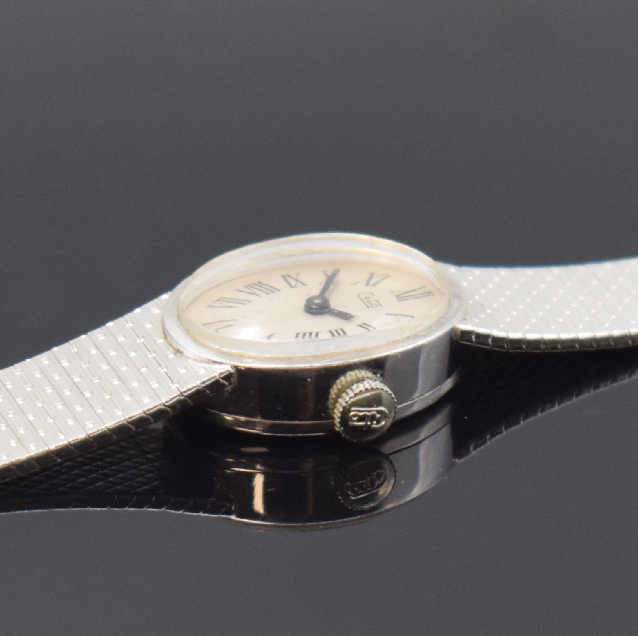 Detail a: CITO Damenarmbanduhr in WG 750/000, Schweiz um 1970, Handaufzug, 2-teil. Gehäuse, Boden aufgedr., silb. Zifferbl. m. röm. Zahlen, rotverg. Werk ...