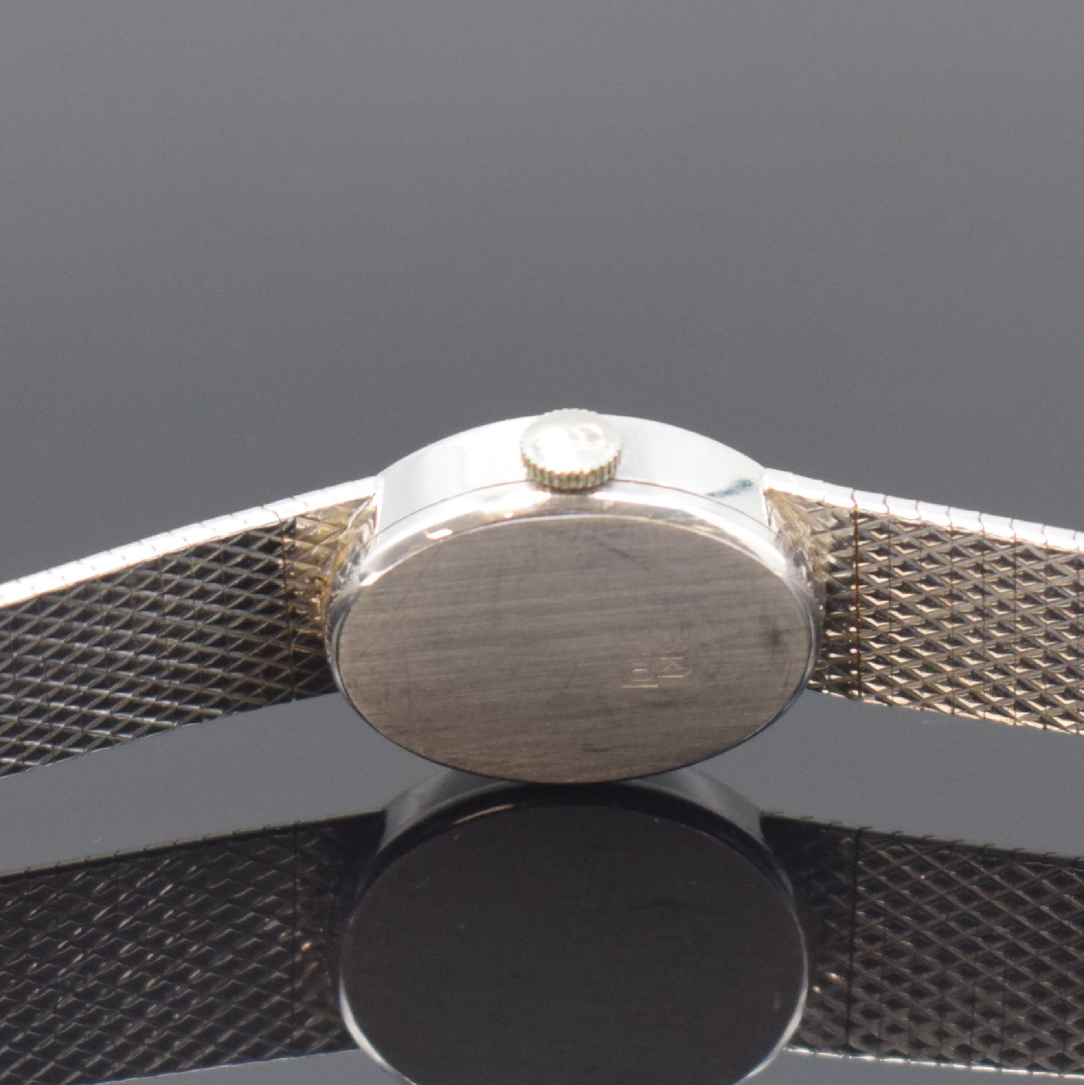 Detail c: CITO Damenarmbanduhr in WG 750/000, Schweiz um 1970, Handaufzug, 2-teil. Gehäuse, Boden aufgedr., silb. Zifferbl. m. röm. Zahlen, rotverg. Werk ...