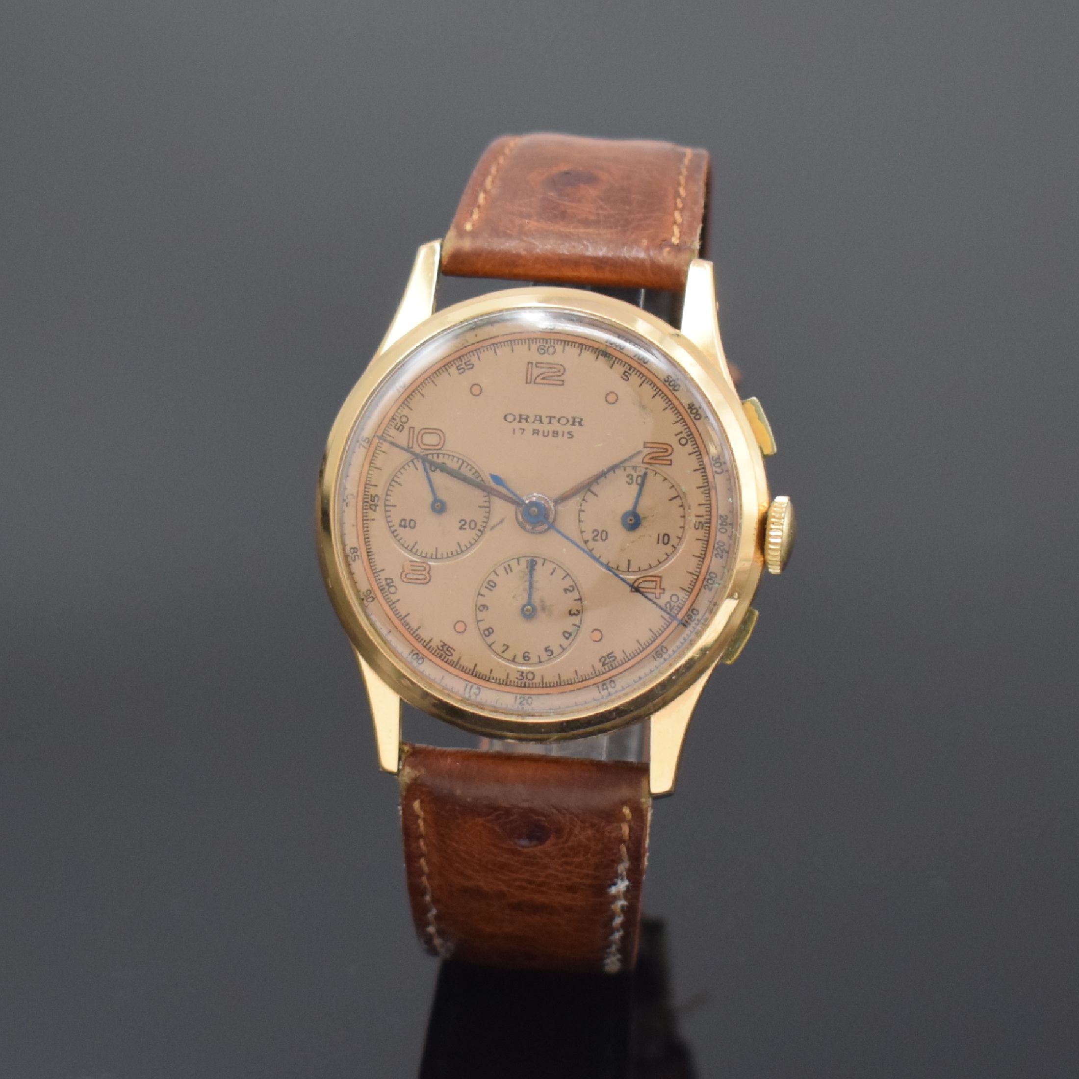 ORATOR Herrenarmbanduhr mit Chronograph in RoseG 750/000, Schweiz um 1950, Handaufzug, 3-teiliges Geh., Boden und Glasrand aufgedr., kupferfarb. ...