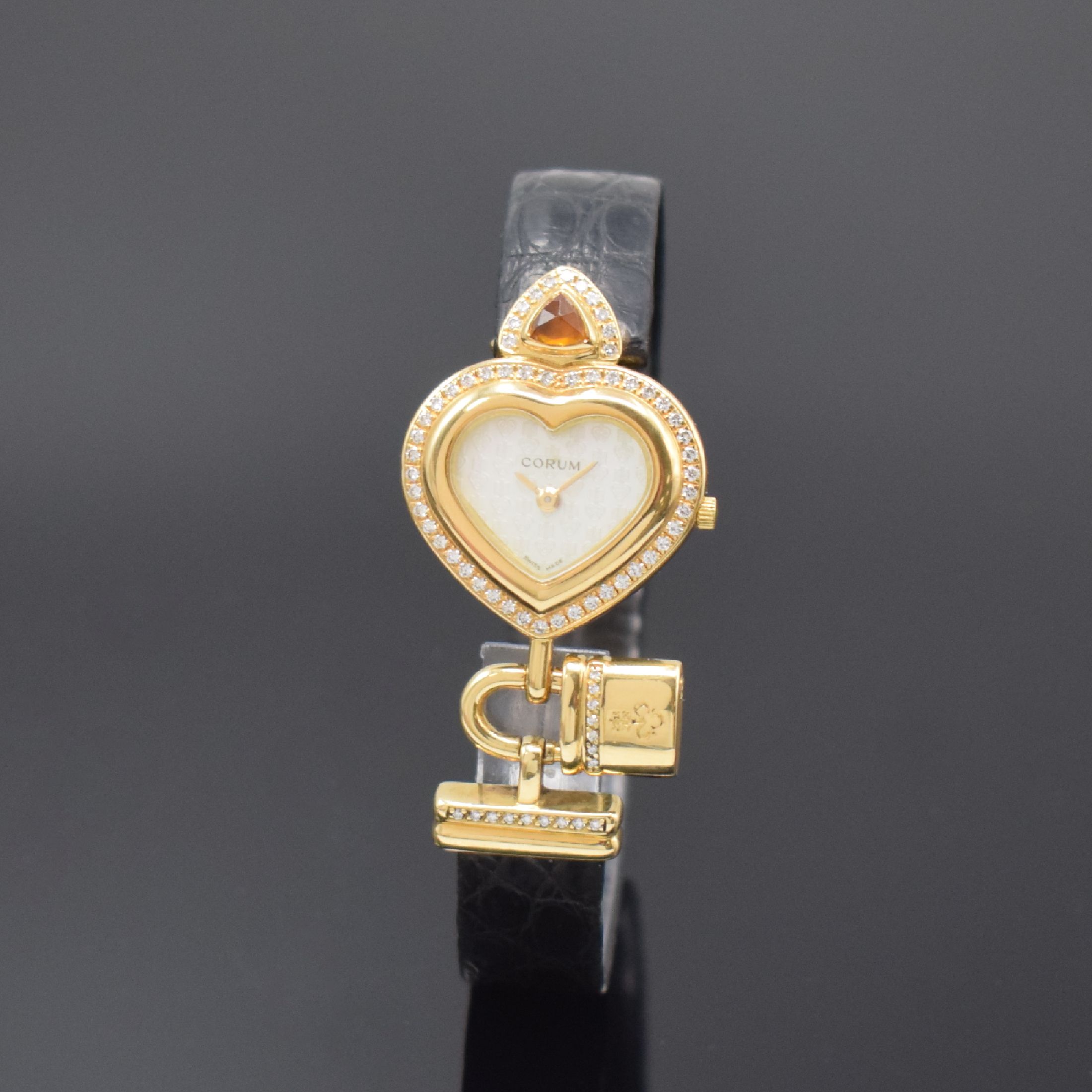 CORUM herzförmige Damenarmbanduhr in GG 750/000, Schweiz um 2010, quarz, Boden 3- fach verschr., Gehäuse aufw. m. Brillanten u. Citrin bes., ...