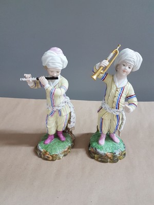 26697678a - 9 porcelain figures from the Turkish chapel, Höchst, and a pair of figures, 2nd half of the20th century, trumpeter, violist, bass, wind player, flute player, etc., polychrome painted, gold decoration, height approx. 18 cm, with a pair of figures, girl and boy with jug, H. approx. 11.5 cm