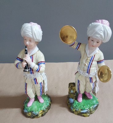 26697678d - 9 porcelain figures from the Turkish chapel, Höchst, and a pair of figures, 2nd half of the20th century, trumpeter, violist, bass, wind player, flute player, etc., polychrome painted, gold decoration, height approx. 18 cm, with a pair of figures, girl and boy with jug, H. approx. 11.5 cm
