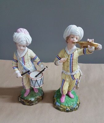 26697678j - 9 porcelain figures from the Turkish chapel, Höchst, and a pair of figures, 2nd half of the20th century, trumpeter, violist, bass, wind player, flute player, etc., polychrome painted, gold decoration, height approx. 18 cm, with a pair of figures, girl and boy with jug, H. approx. 11.5 cm