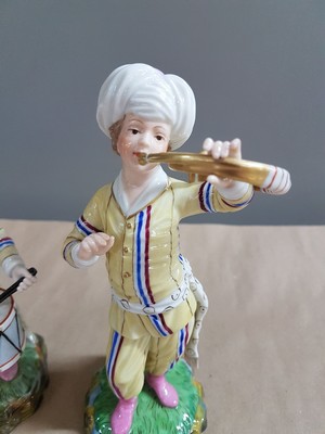 26697678l - 9 porcelain figures from the Turkish chapel, Höchst, and a pair of figures, 2nd half of the20th century, trumpeter, violist, bass, wind player, flute player, etc., polychrome painted, gold decoration, height approx. 18 cm, with a pair of figures, girl and boy with jug, H. approx. 11.5 cm