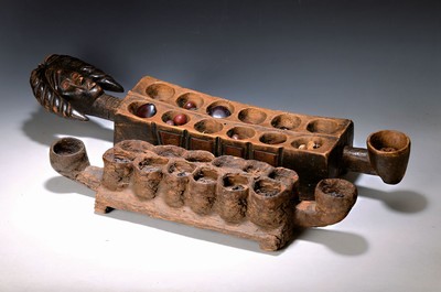 Image 26699128 - Two Mancala game boards, Dan/Liberia and Luba,Hemba/DR Congo, 20th century, carved wood, 12 recesses for the game pieces, partly figurative, traces of age, l. ca. 80 and 68 cm