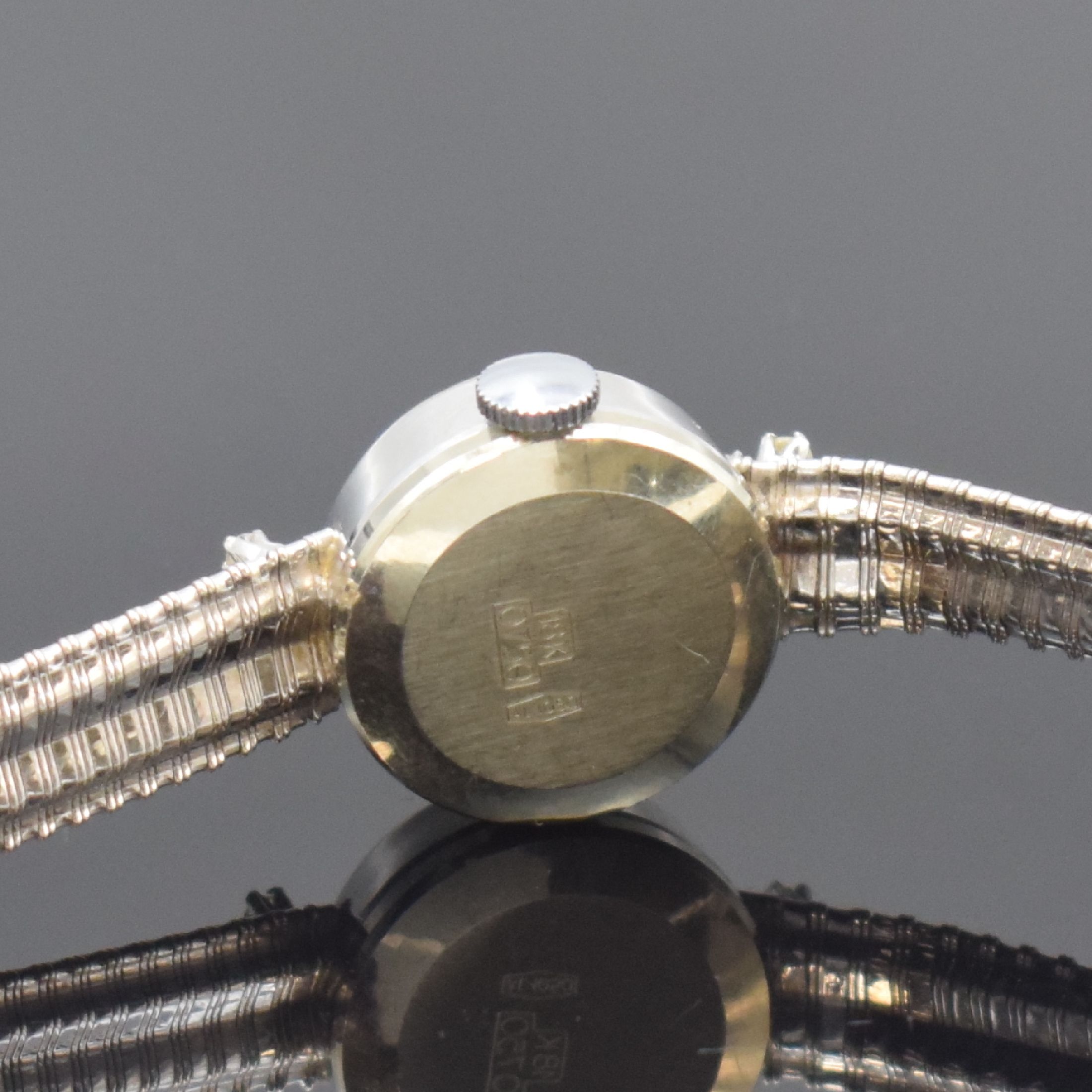 Detail b: METEOR Diamantbesetzte Damenarmbanduhr in WG 750/000, Schweiz um 1960, Handaufzug, 2- teil. Geh. m. aufgedr. Boden, anges. Band, silb. Zifferbl., ...