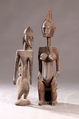 Image 26703361 - Two female figures, Dogon, Mali, 2nd half of the 20th century, carved wood, standing and sitting female figure, incised decoration, traces of age, damaged, H. 68/84 cm