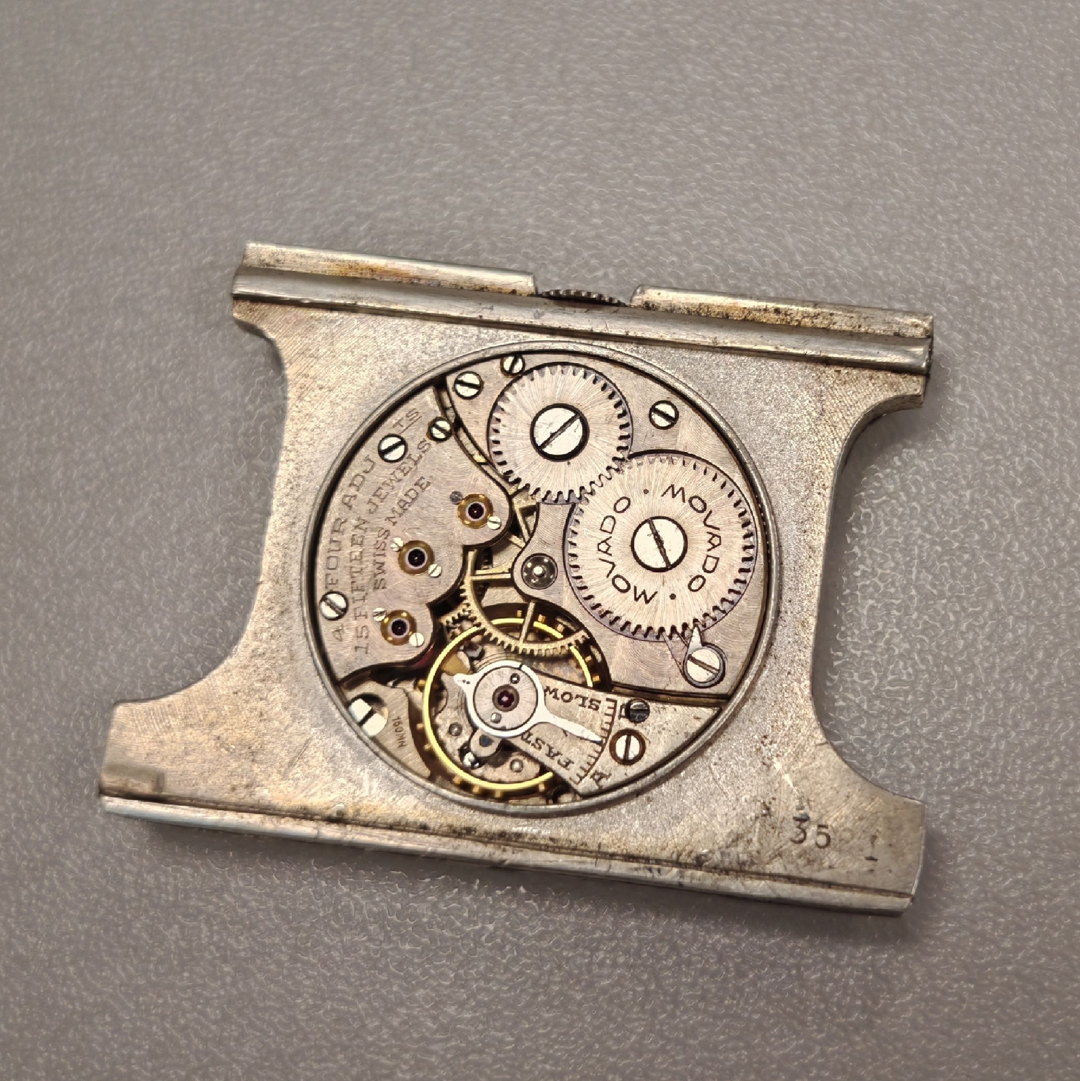 Detail e: MOVADO Ermeto Reiseuhr in 935er Silber, Schweiz um 1935, Geh. dell., Aufzug durch aufschieben u. schließen, silb. Zifferbl. pat./fl., arab. ...