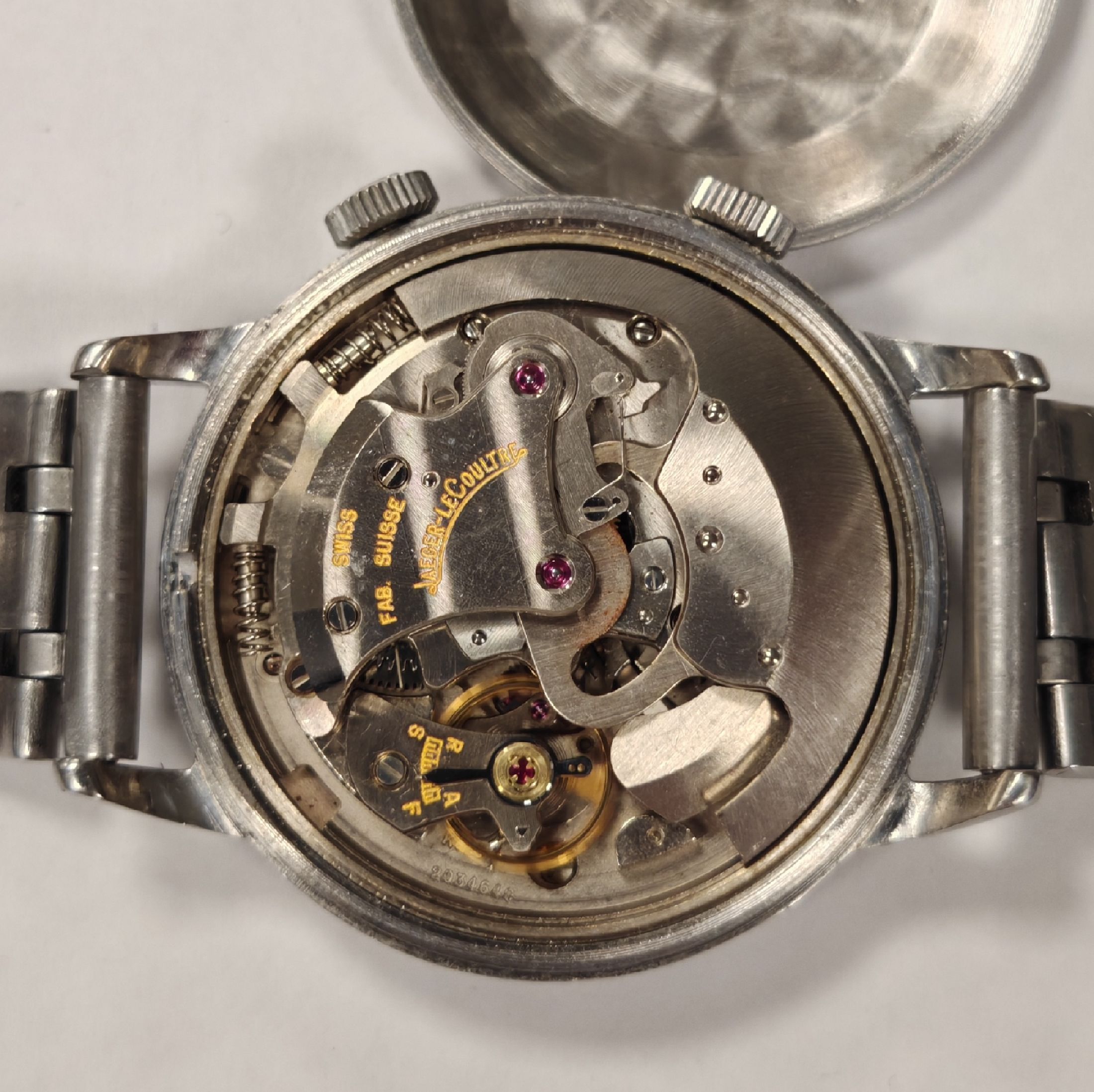Detail c: Jaeger-LeCoultre Herrenarmbanduhr Memovox mit Wecker in Stahl, Schweiz um 1960, Hammerautomatik, Boden verschr., neutr. Stahlband, silb. Zifferbl. ...