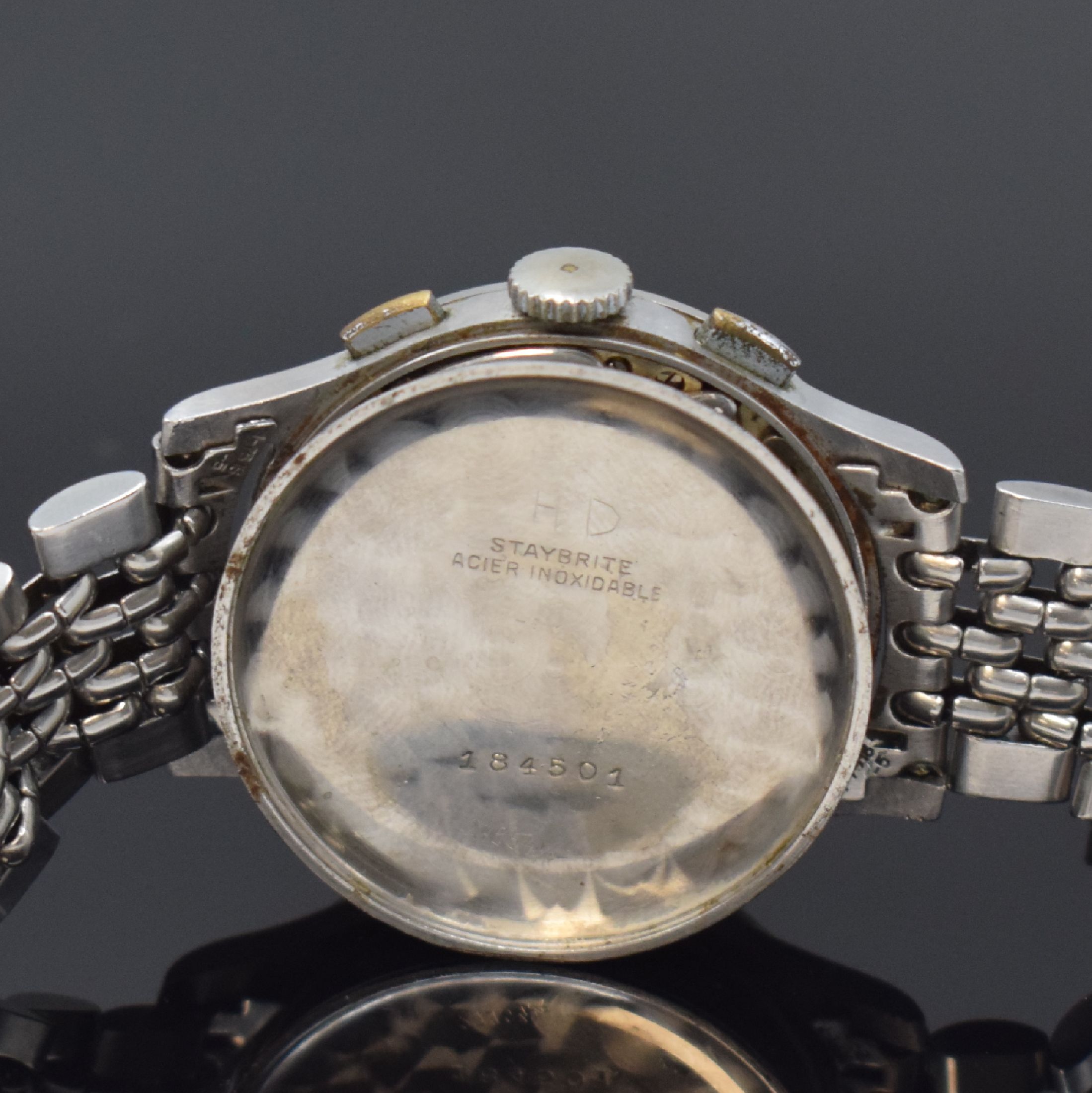 Detail e: ANGELUS Herrenarmbanduhr mit Schaltradchronograph in Stahl, Schweiz um 1945, Handaufzug, Boden aufgedr., neutr. Stahlband, silb. Zifferbl. m. arab. ...