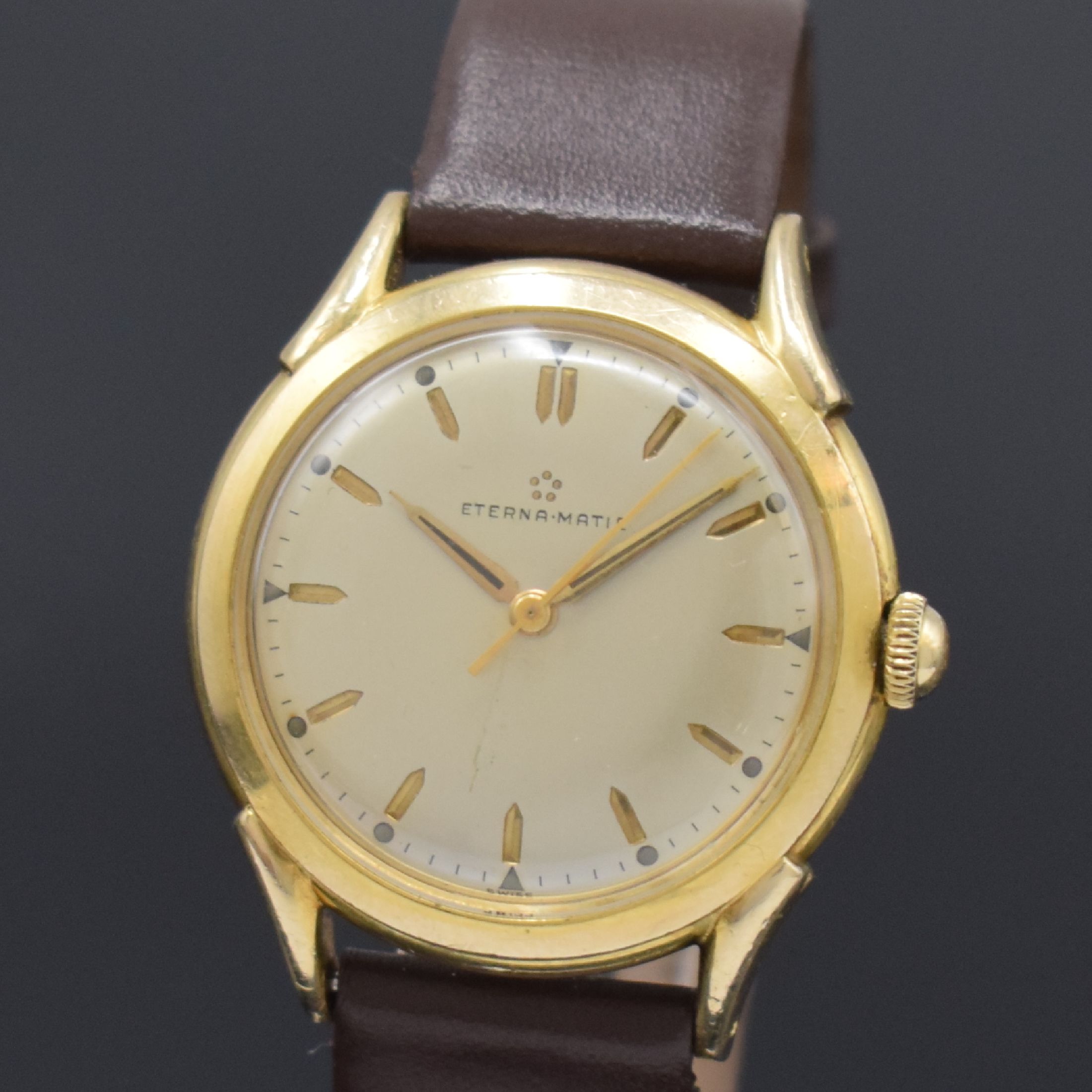 Detail a: ETERNA-MATIC vergoldete Herrenarmbanduhr, Schweiz um 1950, Automatik, Stahlboden verschr., silb. Zifferbl. m. gold. Std.-Ind., gold. Zeiger, Kal. ...