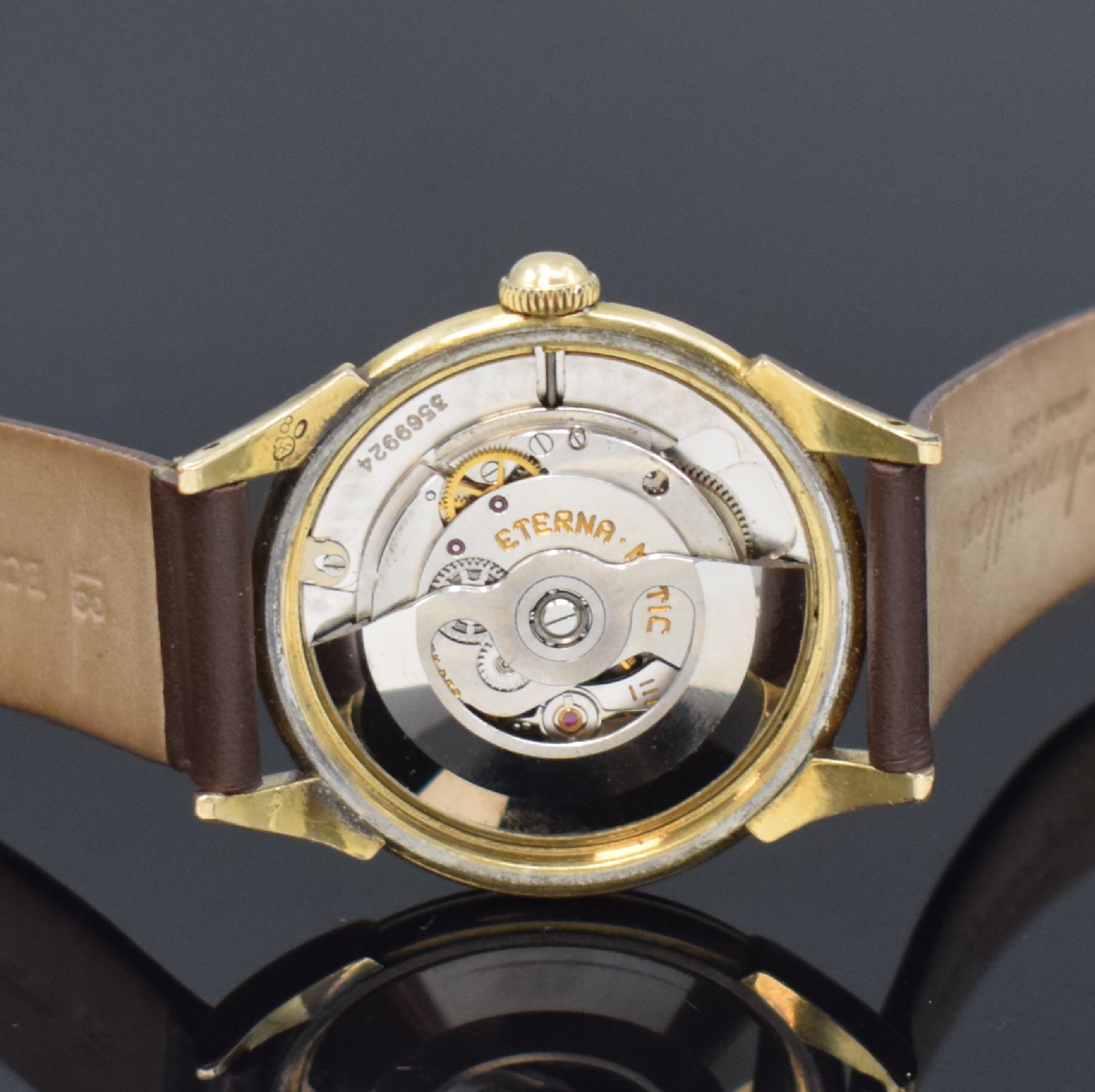 Detail d: ETERNA-MATIC vergoldete Herrenarmbanduhr, Schweiz um 1950, Automatik, Stahlboden verschr., silb. Zifferbl. m. gold. Std.-Ind., gold. Zeiger, Kal. ...